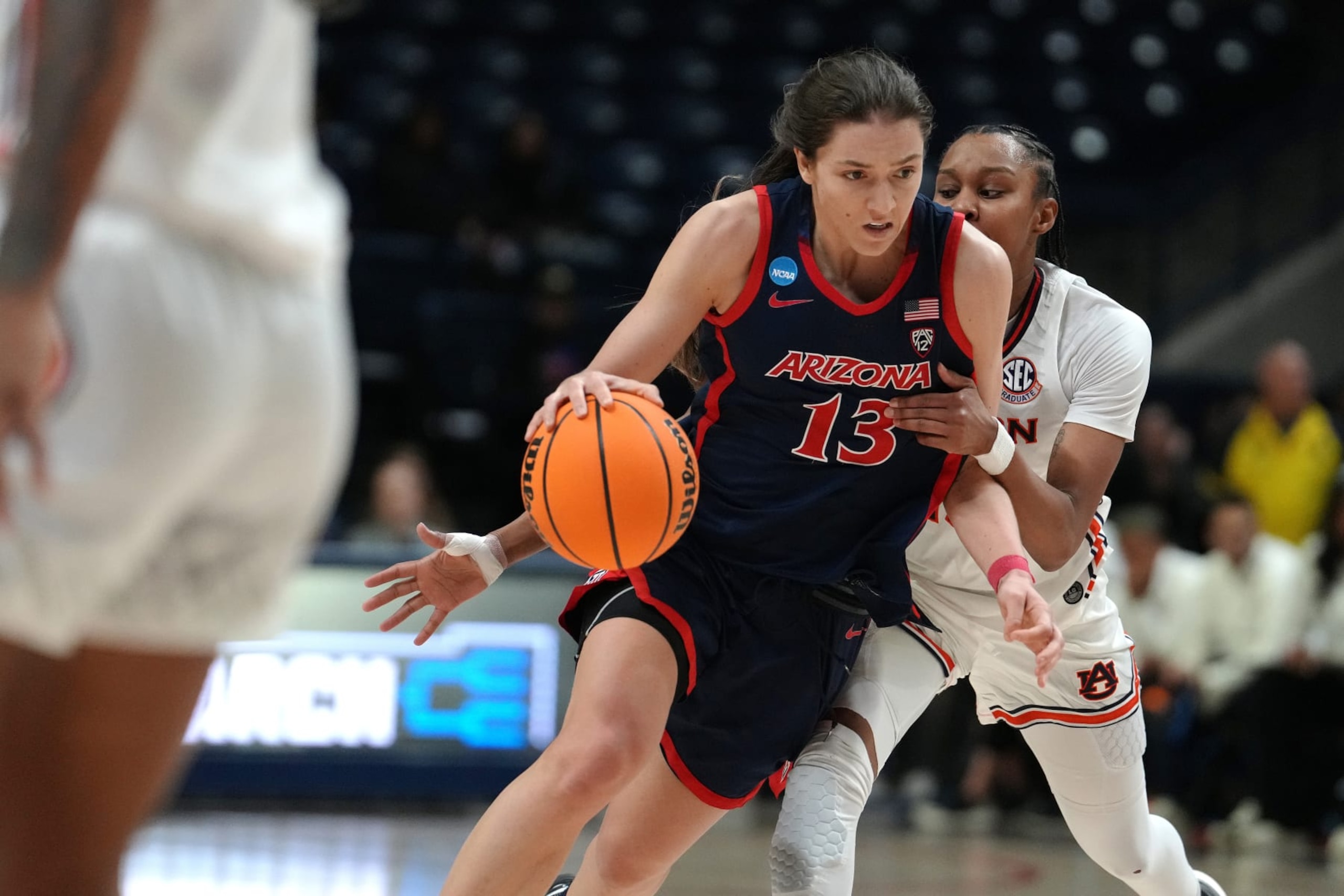 STORRS, CONNECTICUT - MARCH 21: Helena Pueyo #13 of the Arizona Wildcats drives to the rim against the Auburn Tigers during the second half of a First Four game of the NCAA Women's Basketball Tournament at the Harry A. Gampel Pavilion on March 21, 2024 in Storrs, Connecticut. The Wildcats beat the Tigers 69-59. (Photo by Joe Buglewicz/Getty Images) STORRS, CONNECTICUT - MARCH 21: Helena Pueyo #13 of the Arizona Wildcats drives to the rim against the Auburn Tigers during the second half of a First Four game of the NCAA Women's Basketball Tournament at the Harry A. Gampel Pavilion on March 21, 2024 in Storrs, Connecticut. The Wildcats beat the Tigers 69-59. (Photo by Joe Buglewicz/Getty Images)