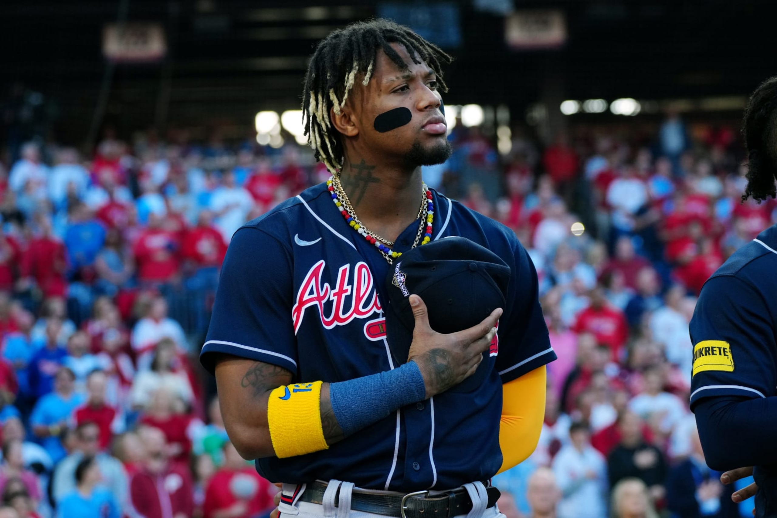 PHILADELPHIA, PA - OCTOBER 11:  Ronald Acuña Jr. #13 of the Atlanta Braves looks on during singing of the national anthem prior to Game 3 of the Division Series between the Atlanta Braves and the Philadelphia Phillies at Citizens Bank Park on Wednesday, October 11, 2023 in Philadelphia, Pennsylvania. (Photo by Mary DeCicco/MLB Photos via Getty Images)