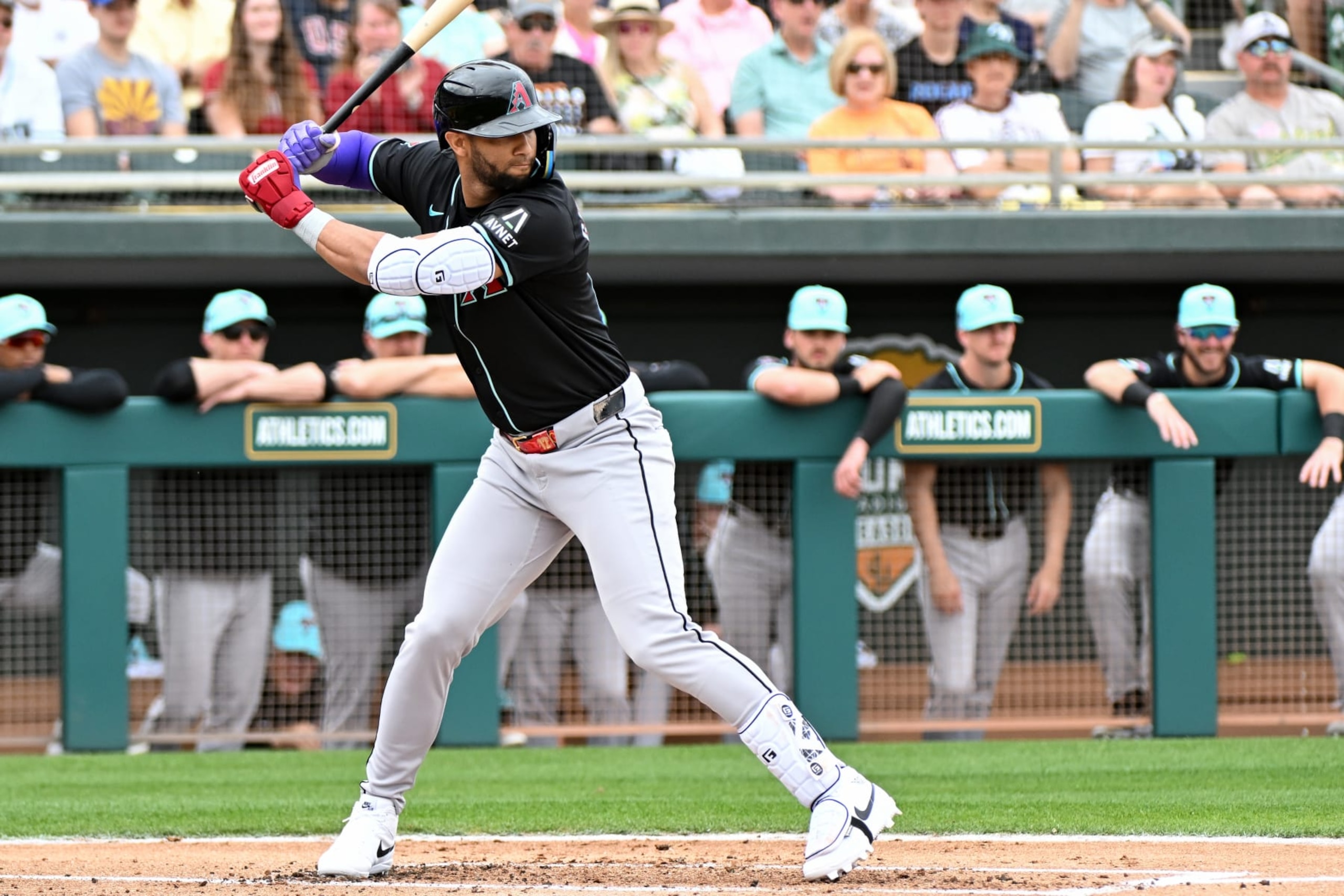 MESA, ARIZONA - FEBRUARY 26, 2024: Lourdes Gurriel Jr. #12 of the Arizona Diamondbacks bats during the first inning of a spring training game against the Oakland Athletics at Hohokam Stadium on February 26, 2024 in Mesa, Arizona. (Photo by David Durochik/Diamond Images via Getty Images)