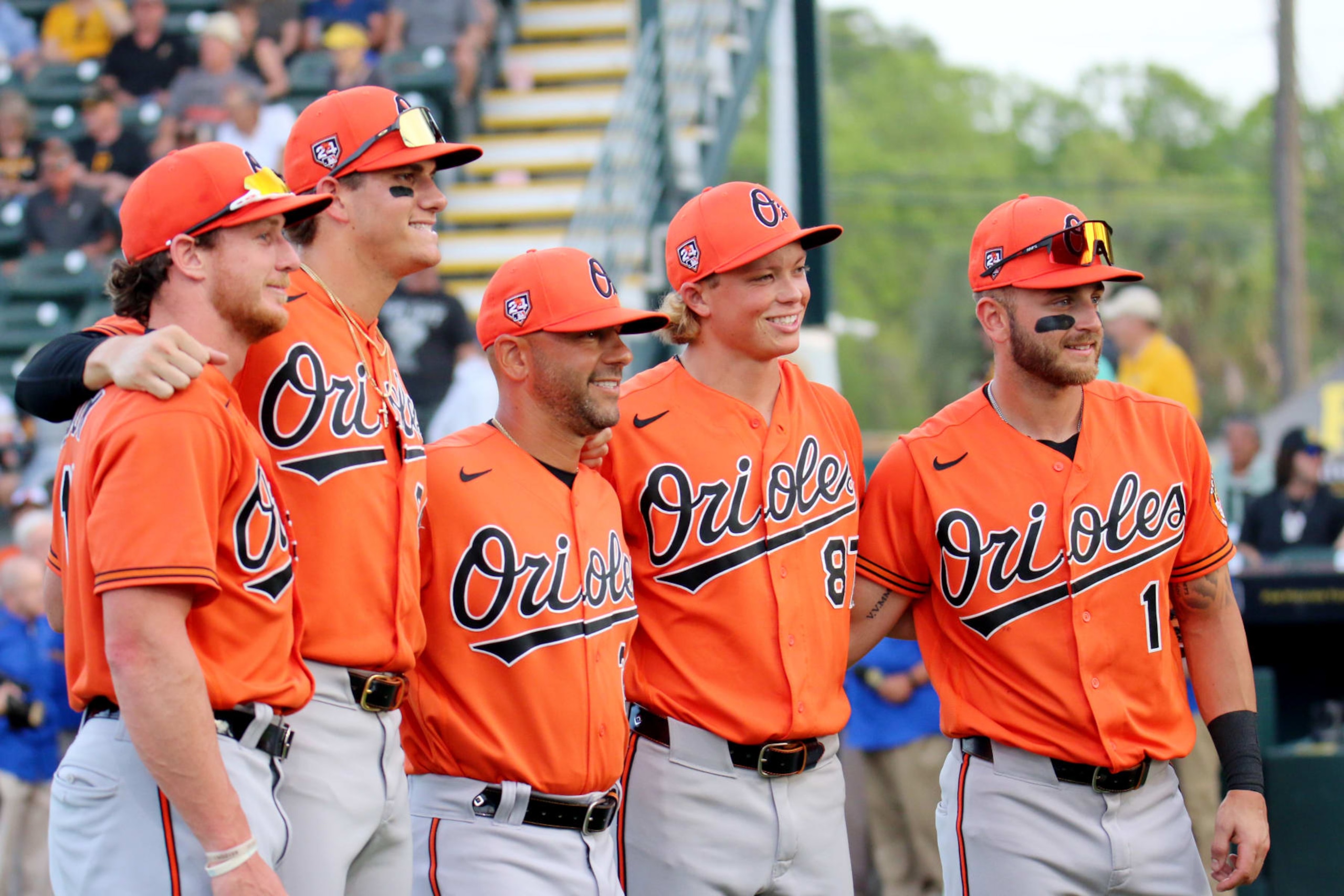 BRADENTON,  - MARCH 14:  Jackson Holliday #87 of the Baltimore Orioles poses with teammates prior to the 2024 Spring Breakout game between the Baltimore Orioles and the Pittsburgh Pirates at LECOM Park on Thursday, March 14, 2024 in Bradenton, Florida. (Photo by Josh Tijong/MLB Photos via Getty Images)