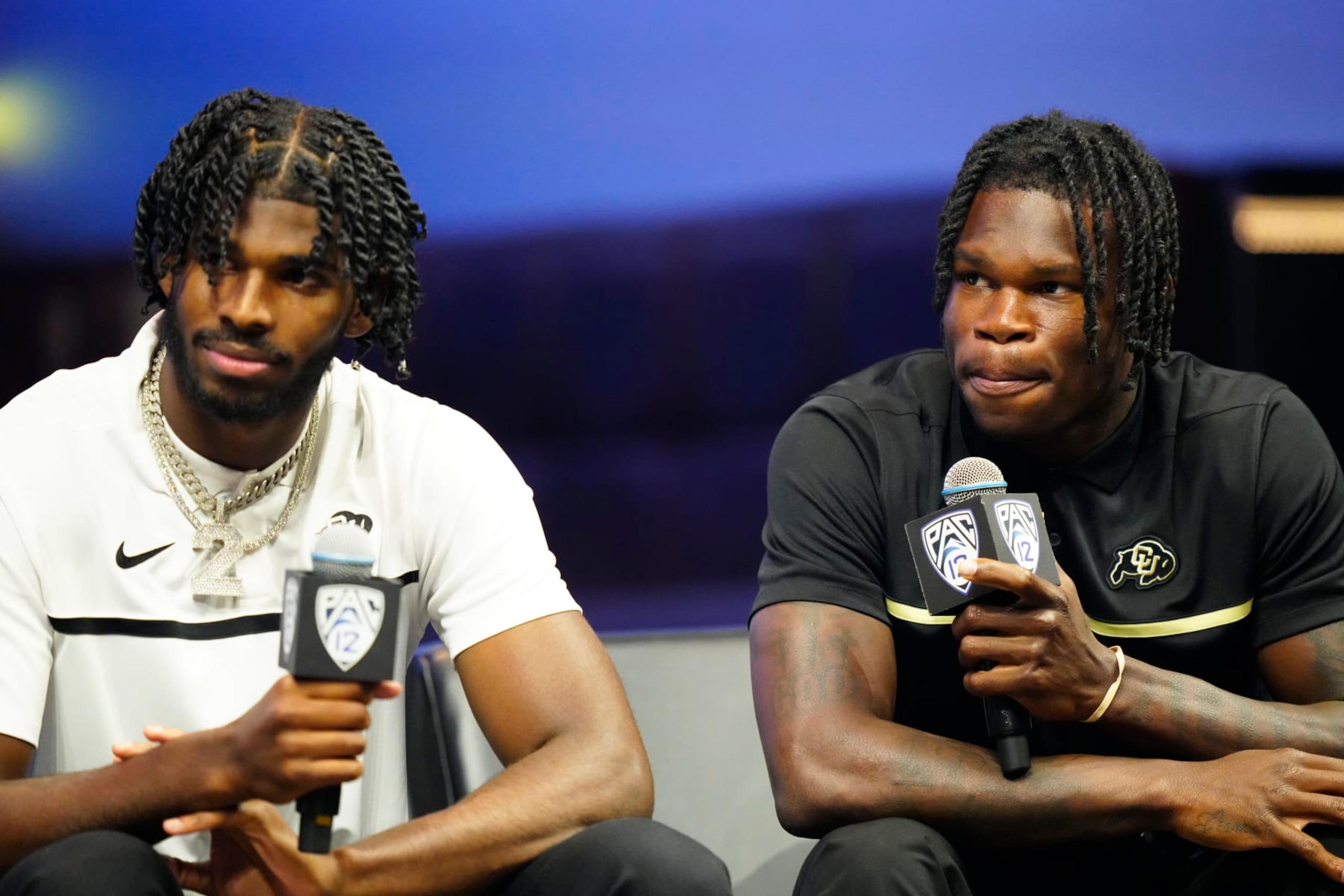 LAS VEGAS, NEVADA - JULY 21: (L-R) Shedeur Sanders #2 and Travis Hunter #12 of the University of Colorado Buffaloes speak with the media at Zouk Nightclub at Resorts World Las Vegas on July 21, 2023 in Las Vegas, Nevada. (Photo by Louis Grasse/Getty Images) LAS VEGAS, NEVADA - JULY 21: (L-R) Shedeur Sanders #2 and Travis Hunter #12 of the University of Colorado Buffaloes speak with the media at Zouk Nightclub at Resorts World Las Vegas on July 21, 2023 in Las Vegas, Nevada. (Photo by Louis Grasse/Getty Images)