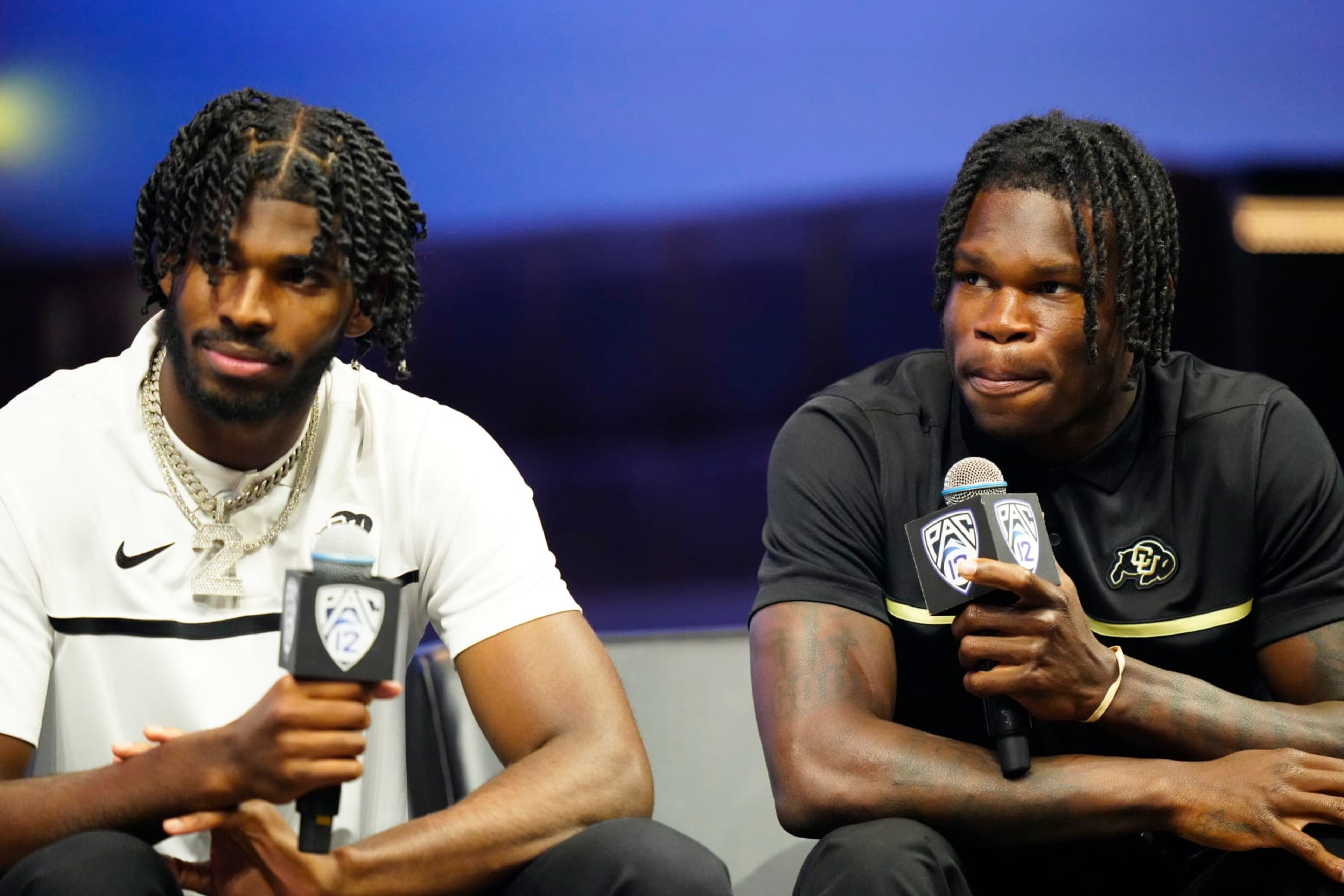 LAS VEGAS, NEVADA - JULY 21: (L-R) Shedeur Sanders #2 and Travis Hunter #12 of the University of Colorado Buffaloes speak with the media at Zouk Nightclub at Resorts World Las Vegas on July 21, 2023 in Las Vegas, Nevada. (Photo by Louis Grasse/Getty Images) LAS VEGAS, NEVADA - JULY 21: (L-R) Shedeur Sanders #2 and Travis Hunter #12 of the University of Colorado Buffaloes speak with the media at Zouk Nightclub at Resorts World Las Vegas on July 21, 2023 in Las Vegas, Nevada. (Photo by Louis Grasse/Getty Images)