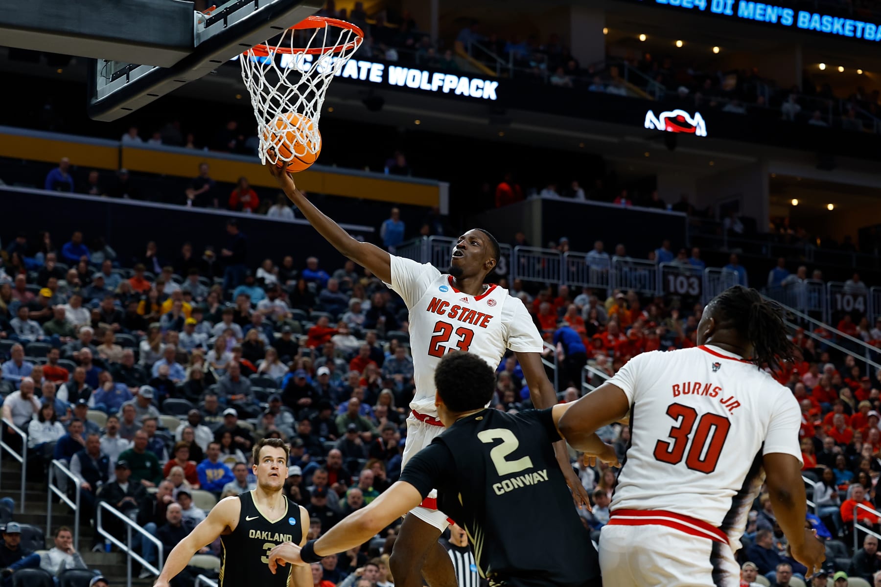 PITTSBURGH, PENNSYLVANIA - MARCH 23: Mohamed Diarra #23 of the North Carolina State Wolfpack goes to the basket in the first half of the game against the Oakland Golden Grizzlies during the second round of the 2024 NCAA Men's Basketball Tournament held at PPG PAINTS Arena on March 23, 2024 in Pittsburgh, Pennsylvania. (Photo by Justin K. Aller/NCAA Photos via Getty Images)