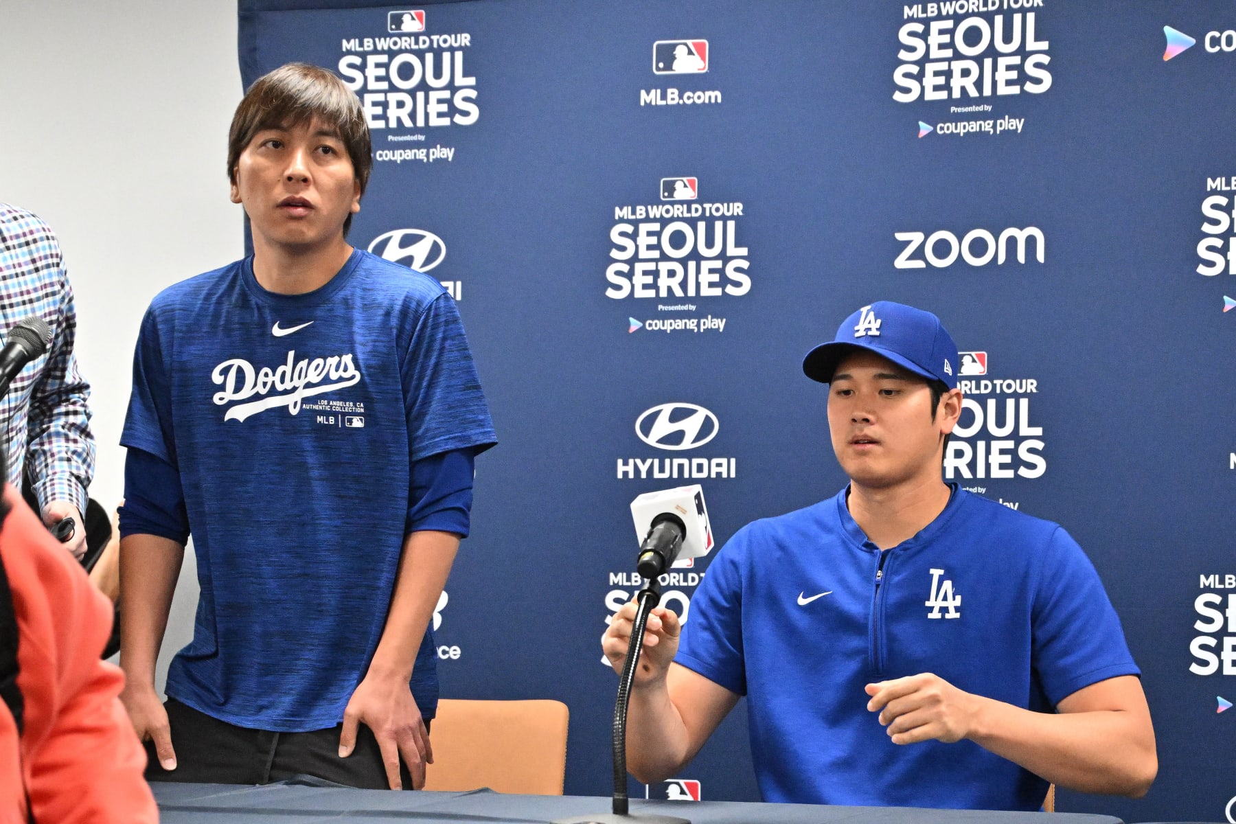 This picture taken on March 16, 2024 shows Los Angeles Dodgers' Shohei Ohtani (R) and his interpreter Ippei Mizuhara (L) attending a press conference at Gocheok Sky Dome in Seoul ahead of the 2024 MLB Seoul Series baseball game between Los Angeles Dodgers and San Diego Padres. The Los Angeles Dodgers said on March 21 they had fired Shohei Ohtani's interpreter after the Japanese baseball star's representatives claimed he had been the victim of "a massive theft" reported to involve millions of dollars. (Photo by Jung Yeon-je / AFP) (Photo by JUNG YEON-JE/AFP via Getty Images)