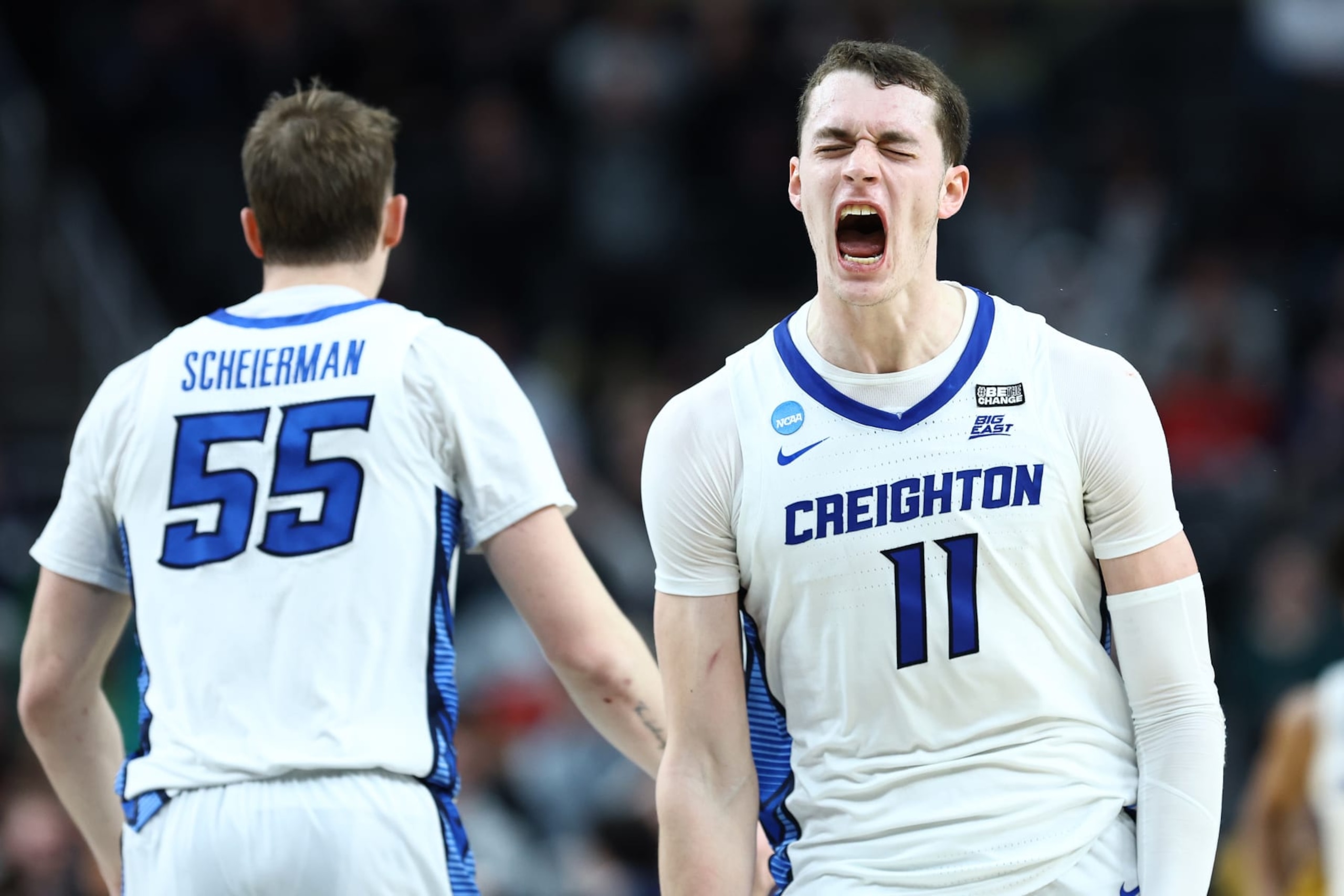 PITTSBURGH, PENNSYLVANIA - MARCH 23: Ryan Kalkbrenner #11 and Francisco Farabello #5 of the Creighton Bluejays react during a second overtime of a game against the Oregon Ducks in the second round of the NCAA Men's Basketball Tournament at PPG PAINTS Arena on March 23, 2024 in Pittsburgh, Pennsylvania. (Photo by Tim Nwachukwu/Getty Images)