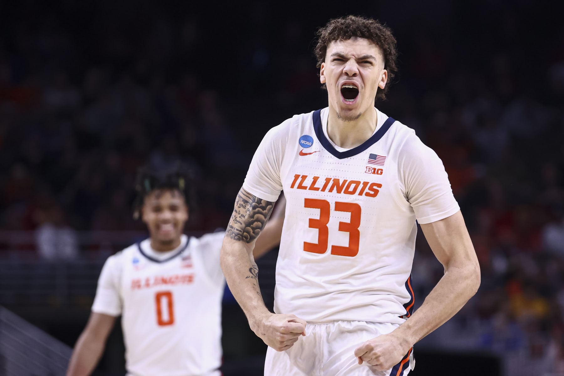 OMAHA, NEBRASKA - MARCH 23: Coleman Hawkins #33 of the Illinois Fighting Illini celebrates during the first half of the game against the Duquesne Dukes during the second round of the 2024 NCAA Men's Basketball Tournament held at CHI Health Center on March 23, 2024 in Omaha, Nebraska. (Photo by Tyler Schank/NCAA Photos via Getty Images)