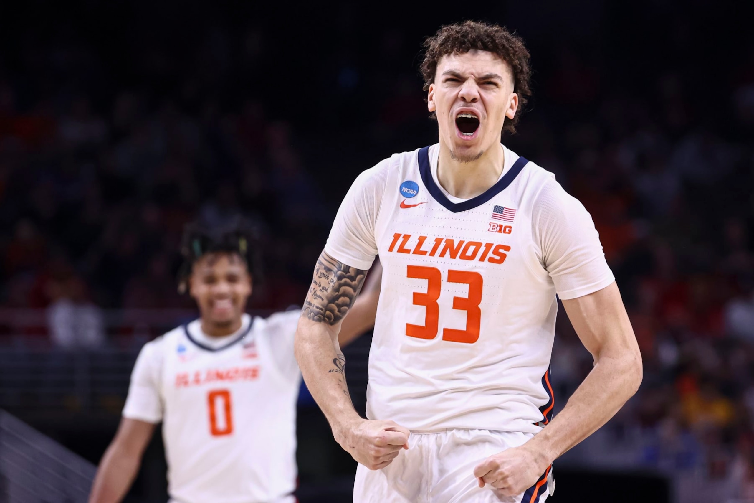 OMAHA, NEBRASKA - MARCH 23: Coleman Hawkins #33 of the Illinois Fighting Illini celebrates during the first half of the game against the Duquesne Dukes during the second round of the 2024 NCAA Men's Basketball Tournament held at CHI Health Center on March 23, 2024 in Omaha, Nebraska. (Photo by Tyler Schank/NCAA Photos via Getty Images)