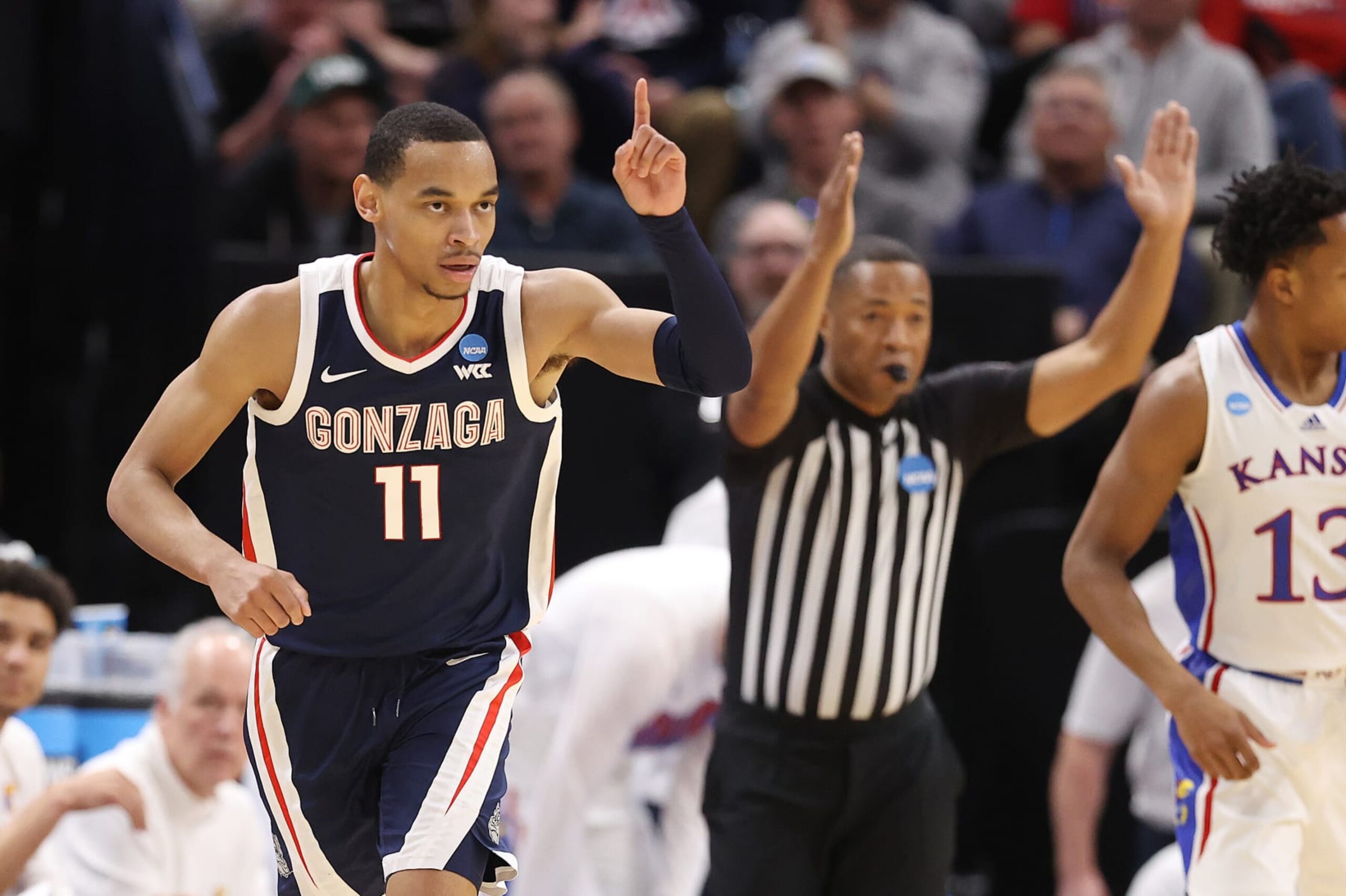 SALT LAKE CITY, UTAH - MARCH 23: Nolan Hickman #11 of the Gonzaga Bulldogs celebrates during the first half against the Kansas Jayhawksin the second round of the NCAA Men's Basketball Tournament at Delta Center on March 23, 2024 in Salt Lake City, Utah. (Photo by Christian Petersen/Getty Images)