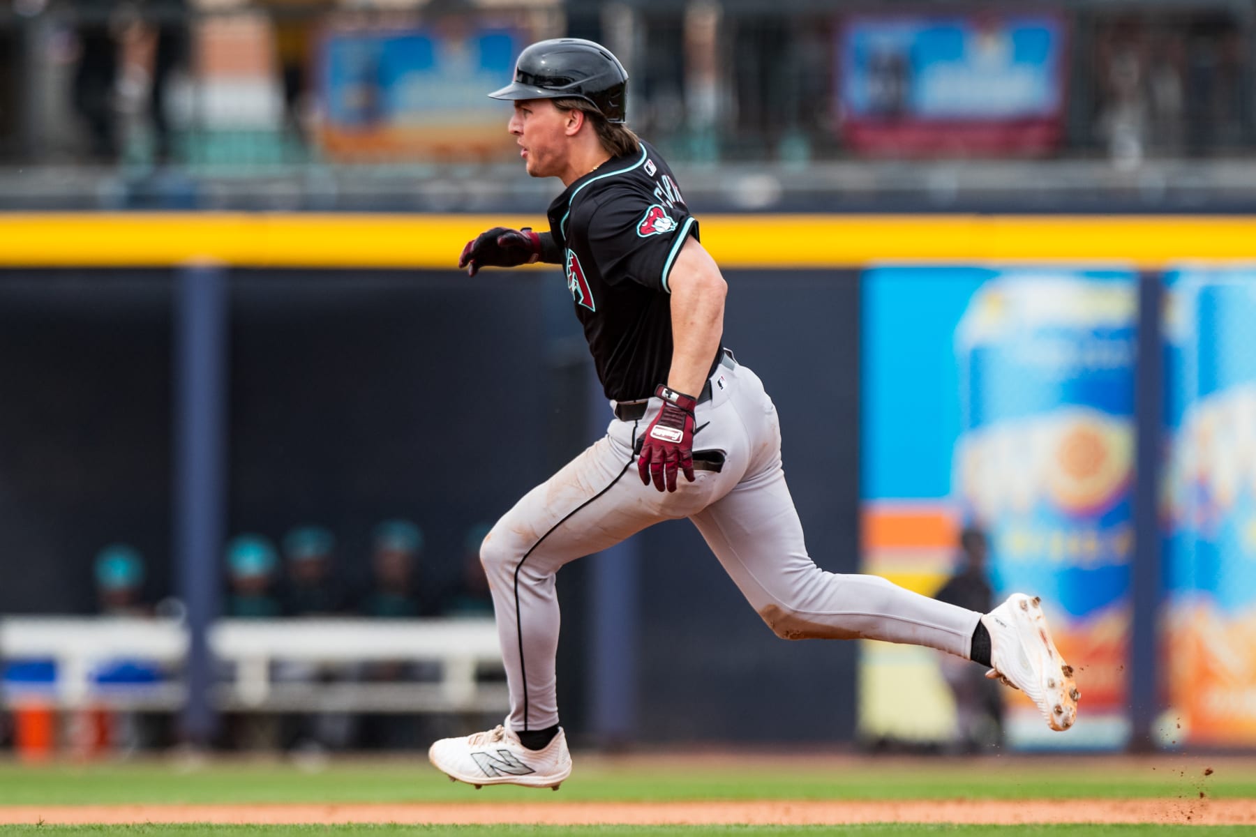 PEORIA, ARIZONA - MARCH 12: Jake McCarthy #31 of the Arizona Diamondbacks runs to third abse during the Spring Training game against the San Diego Padres at Peoria Sports Complex on March 12, 2024 in Peoria, Arizona. (Photo by John E. Moore III/Getty Images)