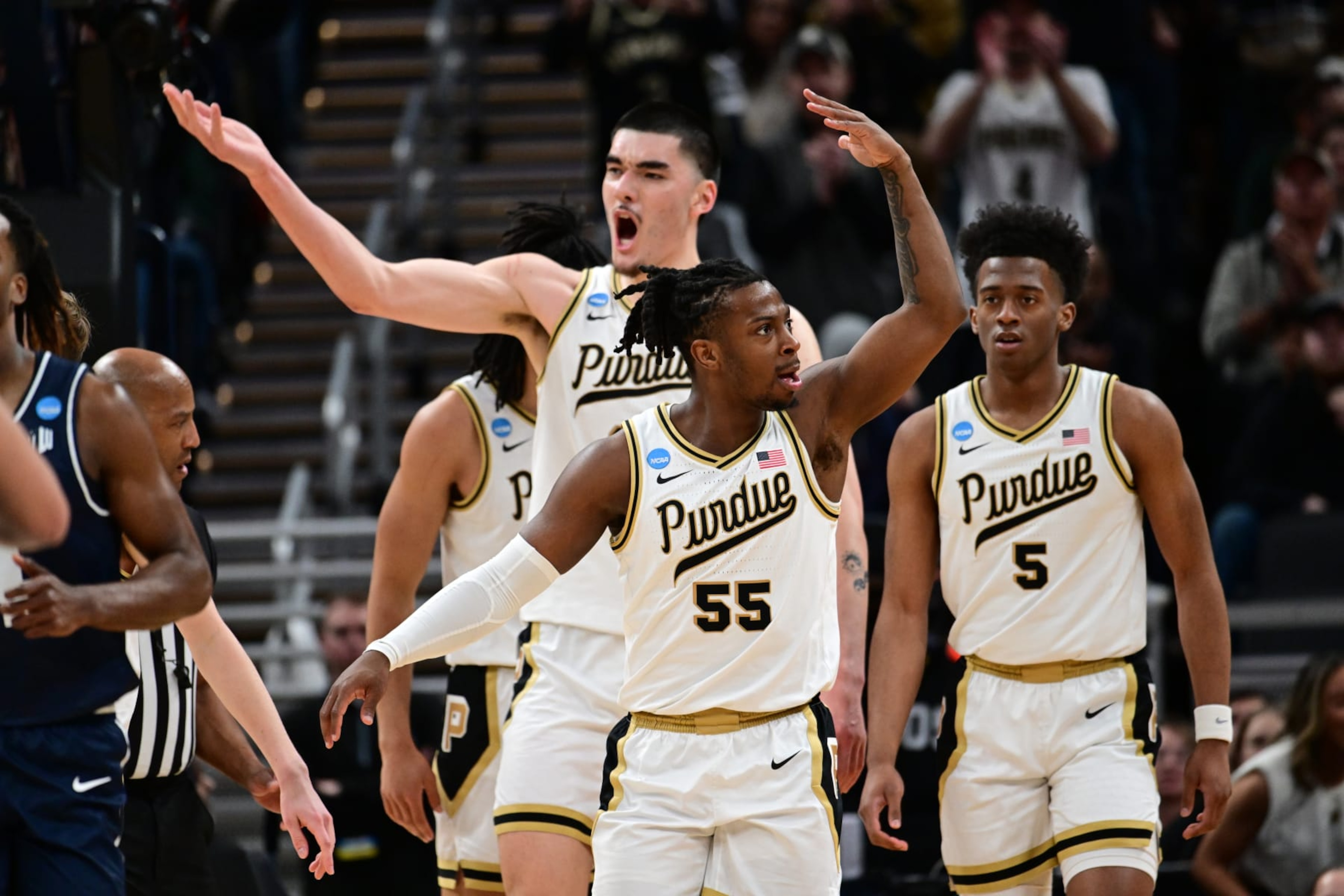 INDIANAPOLIS, INDIANA - MARCH 24: Zach Edey #15 of the Purdue Boilermakers and Lance Jones #55 of the Purdue Boilermakers celebrate a play against the Utah State Aggies during the second round of the 2024 NCAA Men's Basketball Tournament held at Gainbridge Fieldhouse on March 24, 2024 in Indianapolis, Indiana. (Photo by Ben Solomon/NCAA Photos via Getty Images)