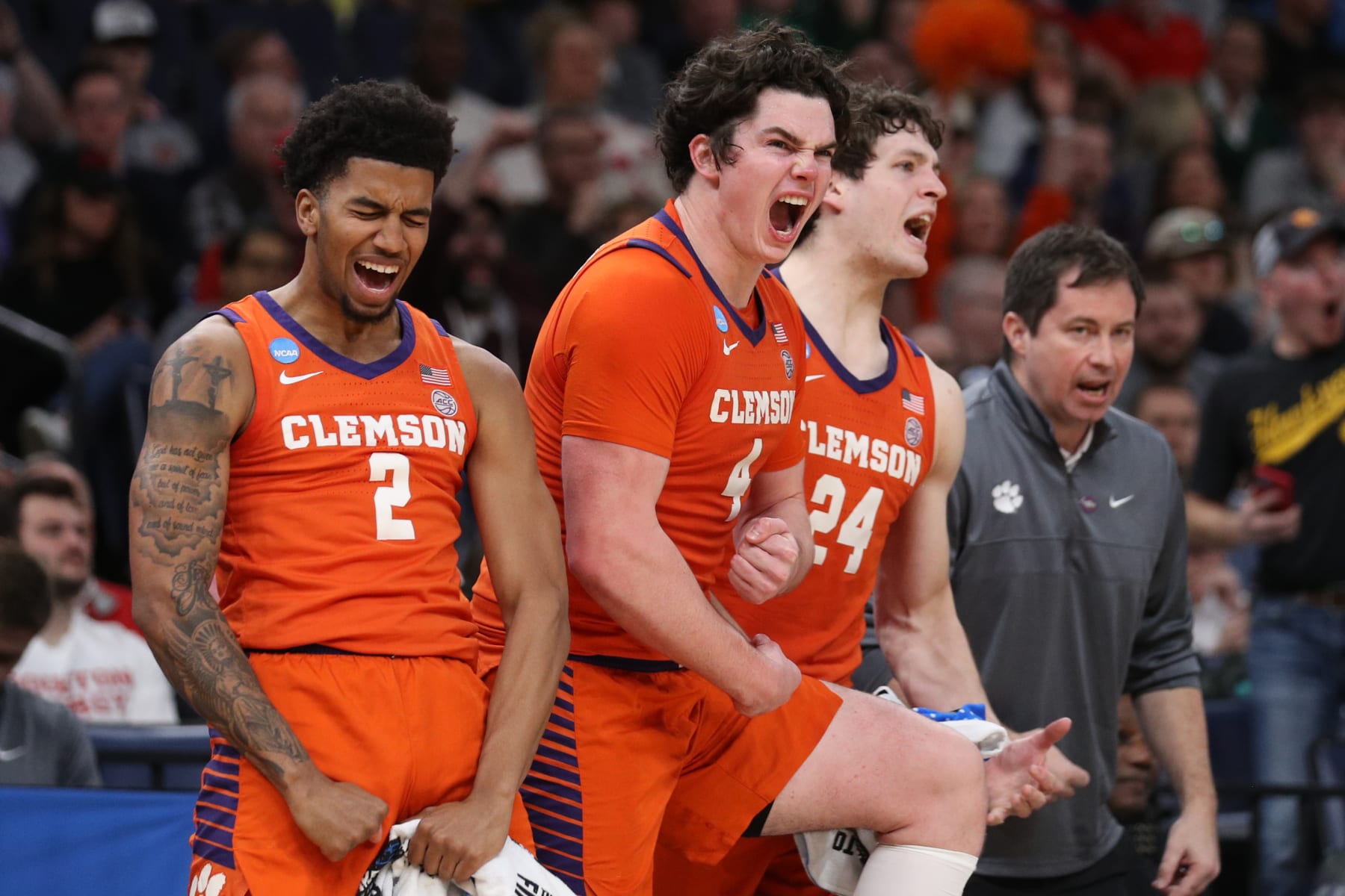 MEMPHIS, TENNESSEE - MARCH 24: Dillon Hunter #2, Ian Schieffelin #4, and PJ Hall #24 of the Clemson Tigers react from the bench during the second half against the Baylor Bears in the second round of the NCAA Men's Basketball Tournament at FedExForum on March 24, 2024 in Memphis, Tennessee. (Photo by Justin Ford/Getty Images)