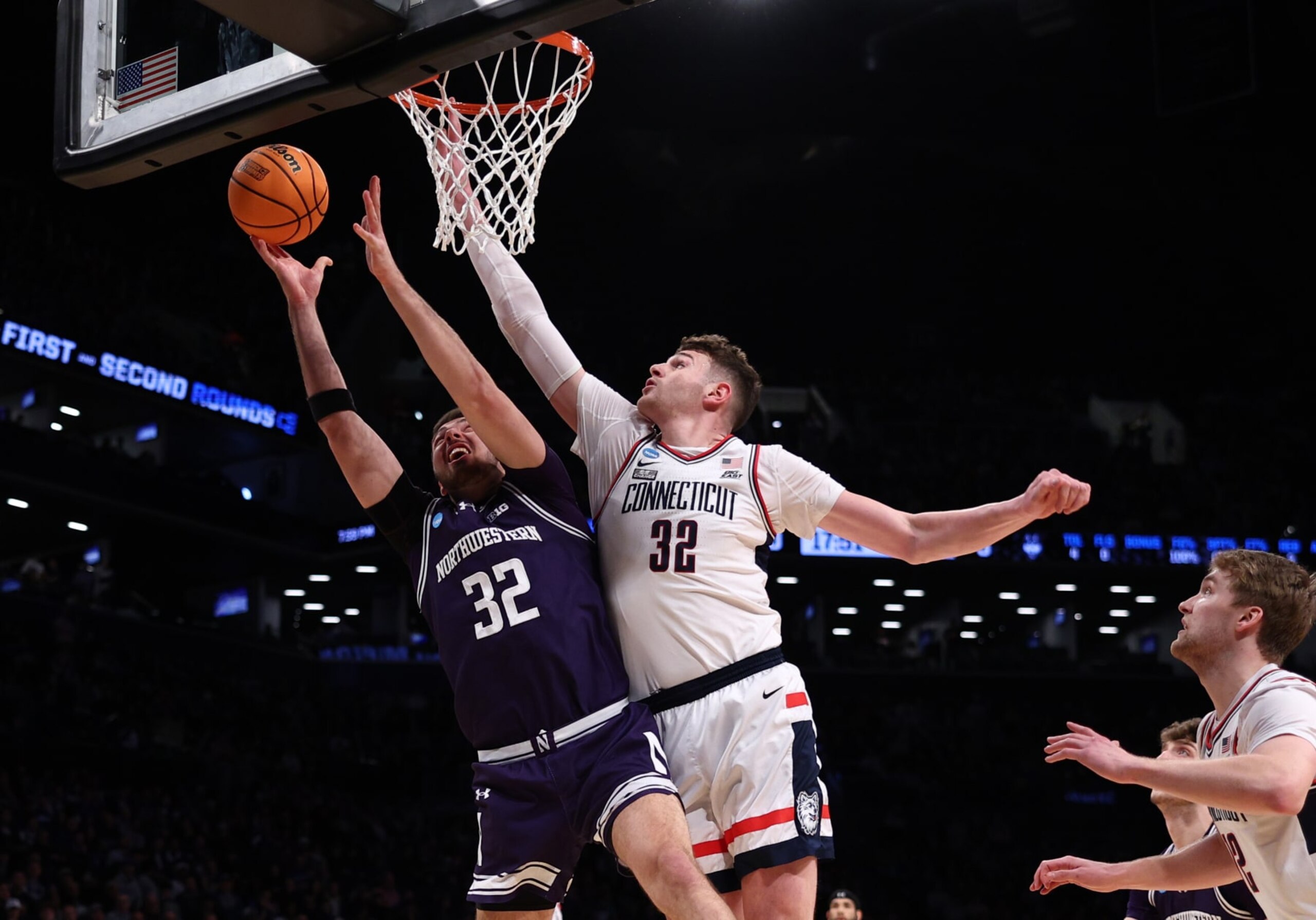 NEW YORK, NEW YORK - MARCH 24: Donovan Clingan #32 of the Connecticut Huskies defends against Blake Preston #32 of the Northwestern Wildcats during the first half in the second round of the NCAA Men's Basketball Tournament at Barclays Center on March 24, 2024 in New York City. (Photo by Elsa/Getty Images) NEW YORK, NEW YORK - MARCH 24: Donovan Clingan #32 of the Connecticut Huskies defends against Blake Preston #32 of the Northwestern Wildcats during the first half in the second round of the NCAA Men's Basketball Tournament at Barclays Center on March 24, 2024 in New York City. (Photo by Elsa/Getty Images)