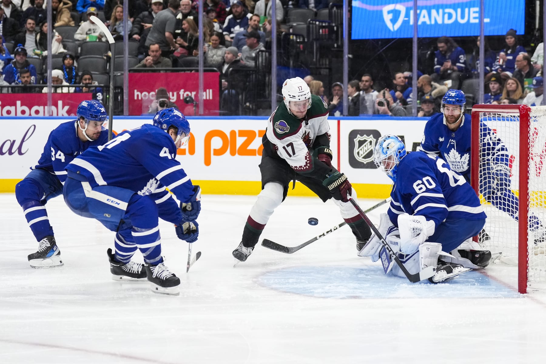 TORONTO, ON - FEBRUARY 29: Morgan Rielly #44 and Joseph Woll #60 of the Toronto Maple Leafs defend against Nick Bjugstad #17 of the Arizona Coyotes during the third period at Scotiabank Arena on February 29, 2024 in Toronto, Ontario, Canada. (Photo by Kevin Sousa/NHLI via Getty Images)