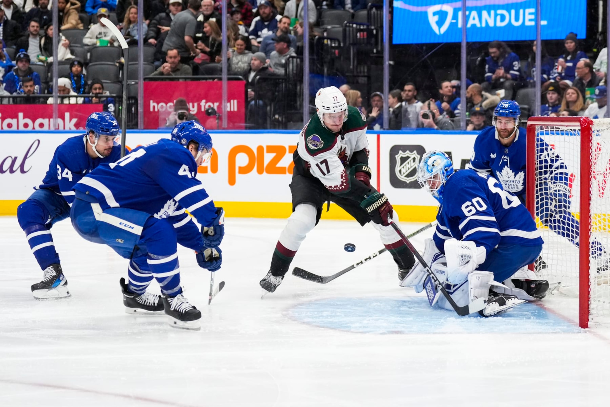 TORONTO, ON - FEBRUARY 29: Morgan Rielly #44 and Joseph Woll #60 of the Toronto Maple Leafs defend against Nick Bjugstad #17 of the Arizona Coyotes during the third period at Scotiabank Arena on February 29, 2024 in Toronto, Ontario, Canada. (Photo by Kevin Sousa/NHLI via Getty Images)