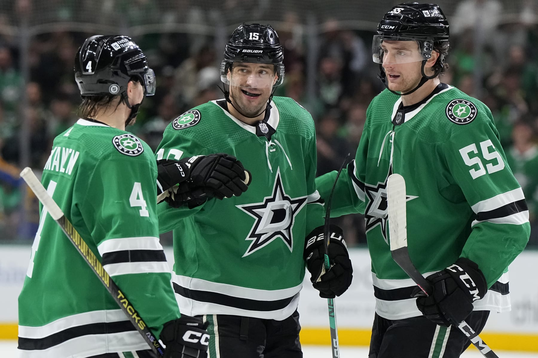 DALLAS, TEXAS - MARCH 16: Craig Smith #15 of the Dallas Stars is congratulated by Miro Heiskanen #4 and Thomas Harley #55 after scoring Smith scored a goal during the first period against the Los Angeles Kings at American Airlines Center on March 16, 2024 in Dallas, Texas. (Photo by Sam Hodde/Getty Images)