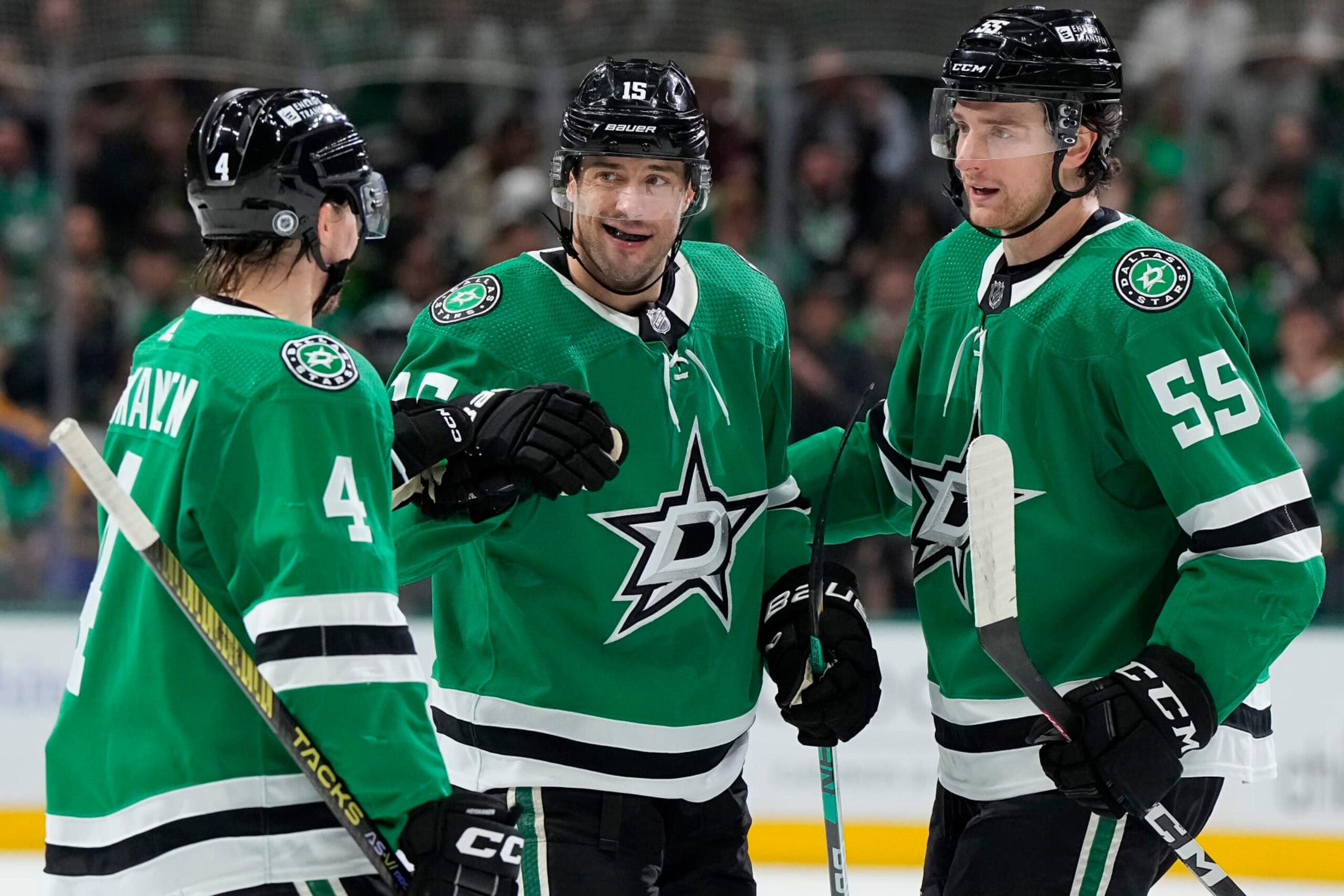 DALLAS, TEXAS - MARCH 16: Craig Smith #15 of the Dallas Stars is congratulated by Miro Heiskanen #4 and Thomas Harley #55 after scoring Smith scored a goal during the first period against the Los Angeles Kings at American Airlines Center on March 16, 2024 in Dallas, Texas. (Photo by Sam Hodde/Getty Images)