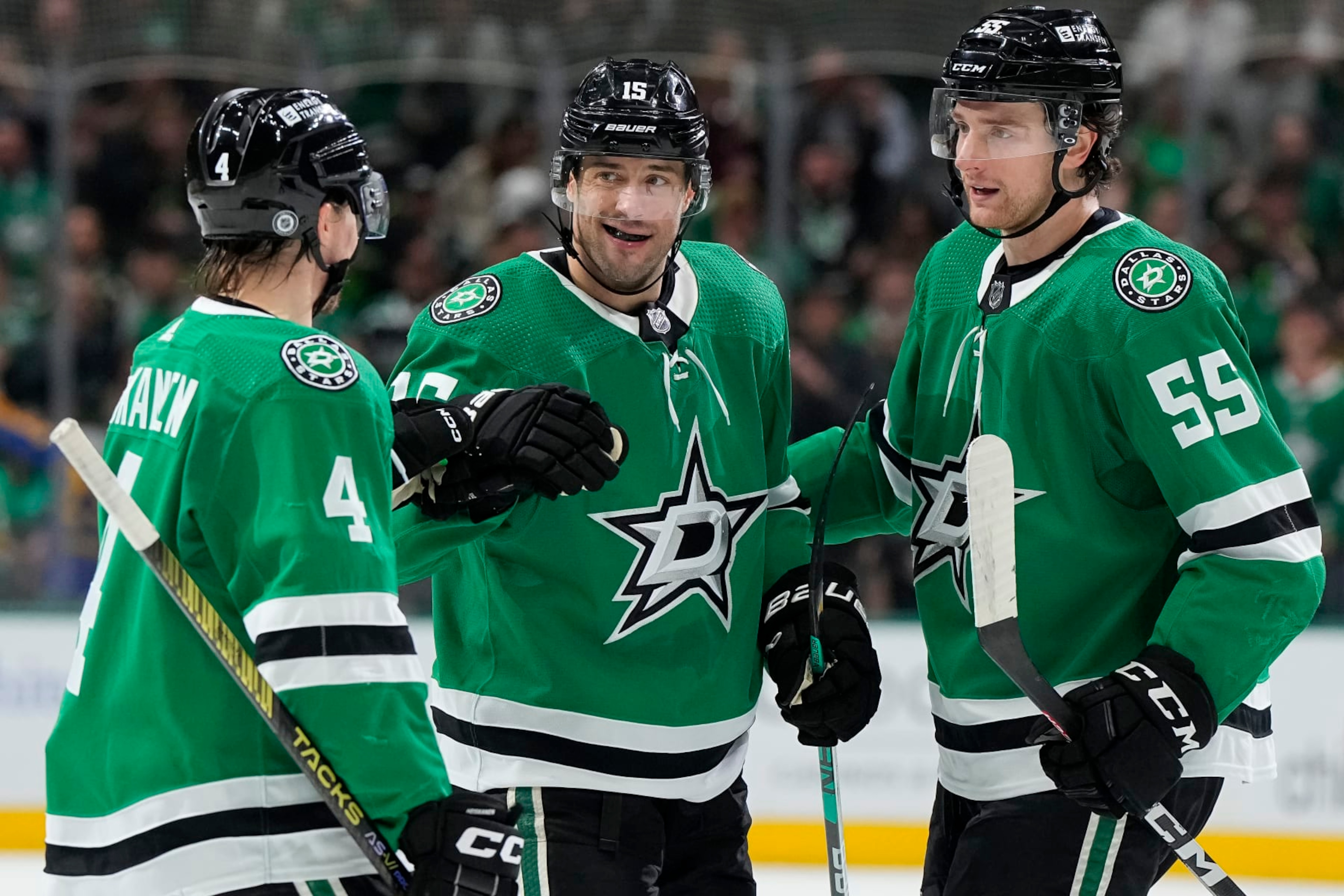 DALLAS, TEXAS - MARCH 16: Craig Smith #15 of the Dallas Stars is congratulated by Miro Heiskanen #4 and Thomas Harley #55 after scoring Smith scored a goal during the first period against the Los Angeles Kings at American Airlines Center on March 16, 2024 in Dallas, Texas. (Photo by Sam Hodde/Getty Images)