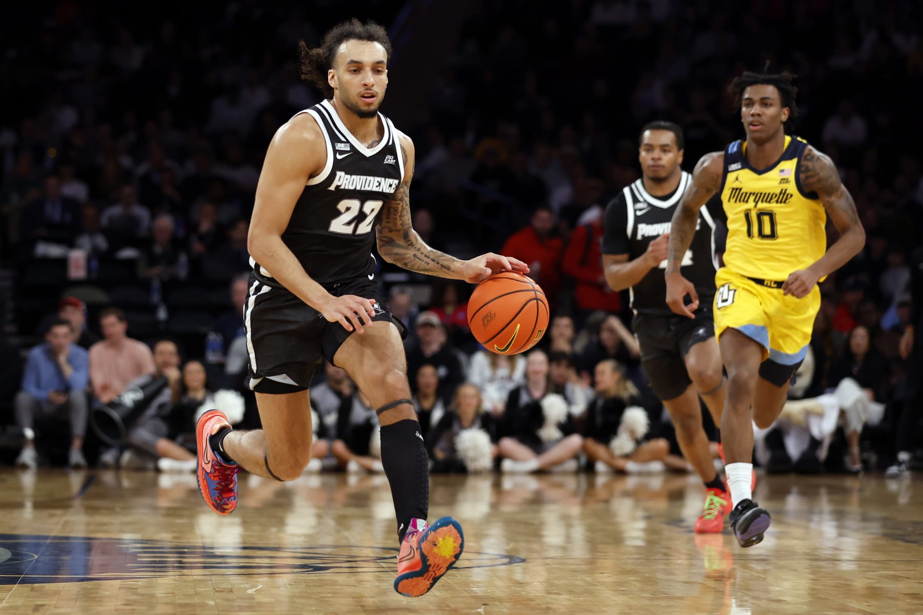NEW YORK, NEW YORK - MARCH 15: Devin Carter #22 of the Providence Friars dribbles in the first half against the Marquette Golden Eagles during the Semifinal round of the Big East Basketball Tournament at Madison Square Garden on March 15, 2024 in New York City. (Photo by Sarah Stier/Getty Images)