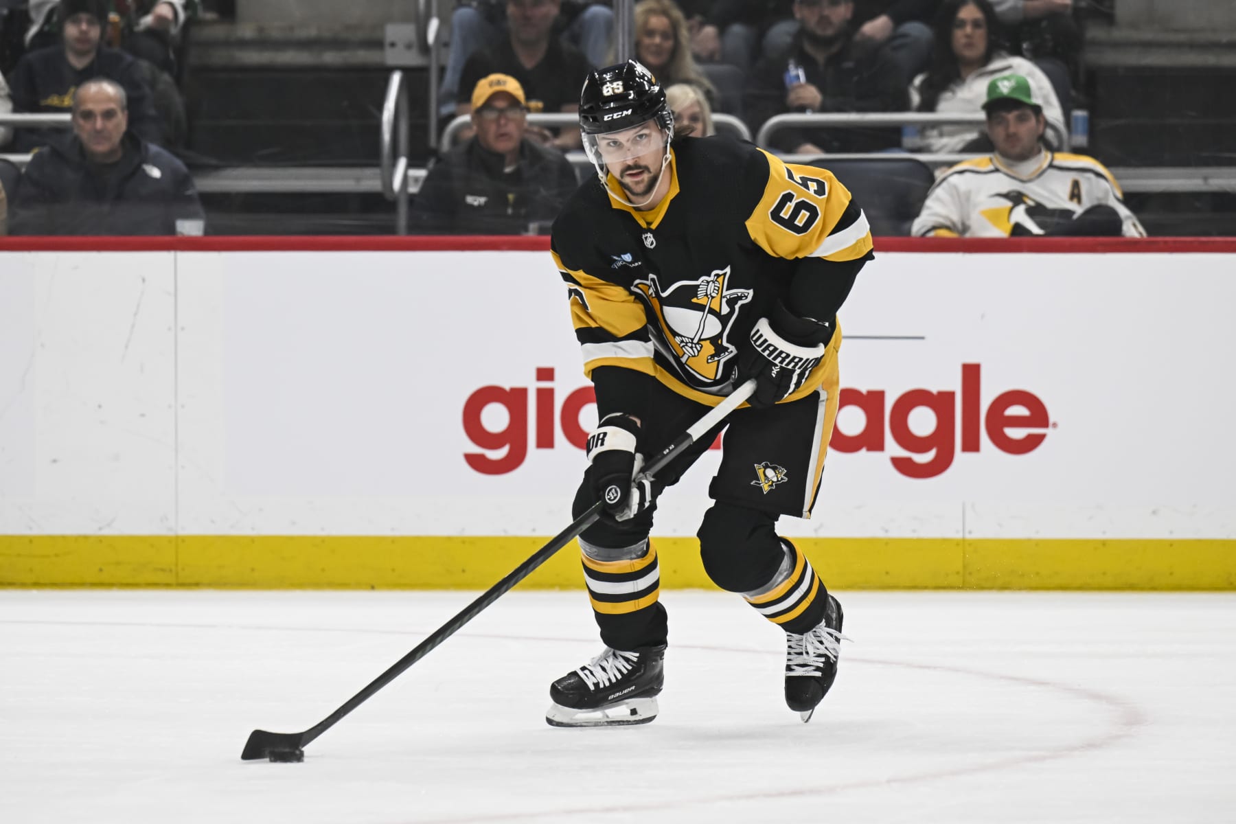 PITTSBURGH, PA - MARCH 17: Pittsburgh Penguins defenseman Erik Karlsson (65) skates with the puck during the first period in the NHL game between the Pittsburgh Penguins and the Detroit Red Wings on March 17, 2024, at PPG Paints Arena in Pittsburgh, PA. (Photo by Jeanine Leech/Icon Sportswire via Getty Images)