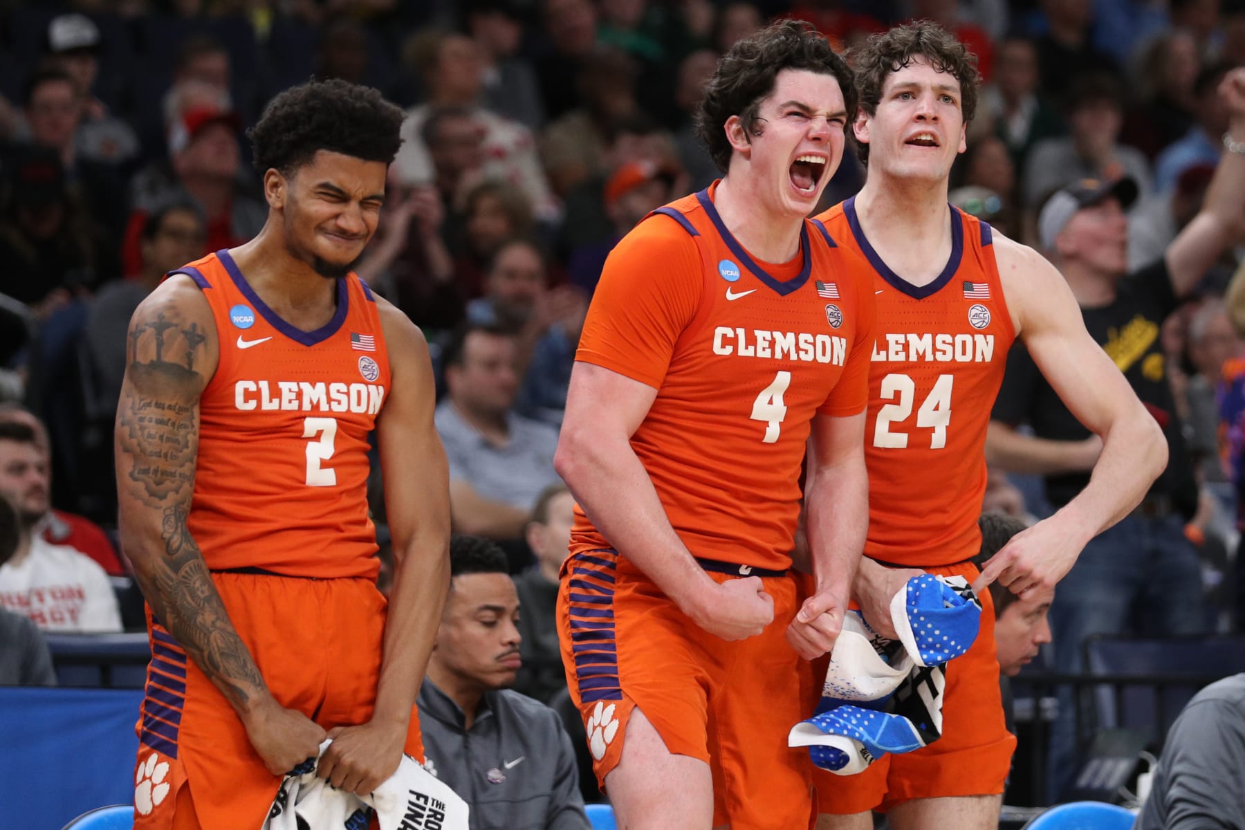 MEMPHIS, TENNESSEE - MARCH 24: Dillon Hunter #2, Ian Schieffelin #4, and PJ Hall #24 of the Clemson Tigers react from the bench during the second half against the Baylor Bears in the second round of the NCAA Men's Basketball Tournament at FedExForum on March 24, 2024 in Memphis, Tennessee. (Photo by Justin Ford/Getty Images)