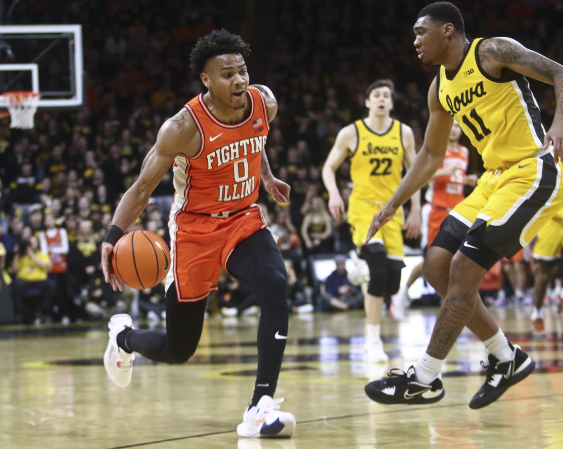 IOWA CITY, IOWA - FEBRUARY 04:  Guard Terrence Shannon #0 of the Illinois Fighting Illini drives to the basket during the first half against guard Tony Perkins #11 of the Iowa Hawkeyes  at Carver-Hawkeye Arena, on February 4, 2023 in Iowa City, Iowa.  (Photo by Matthew Holst/Getty Images)