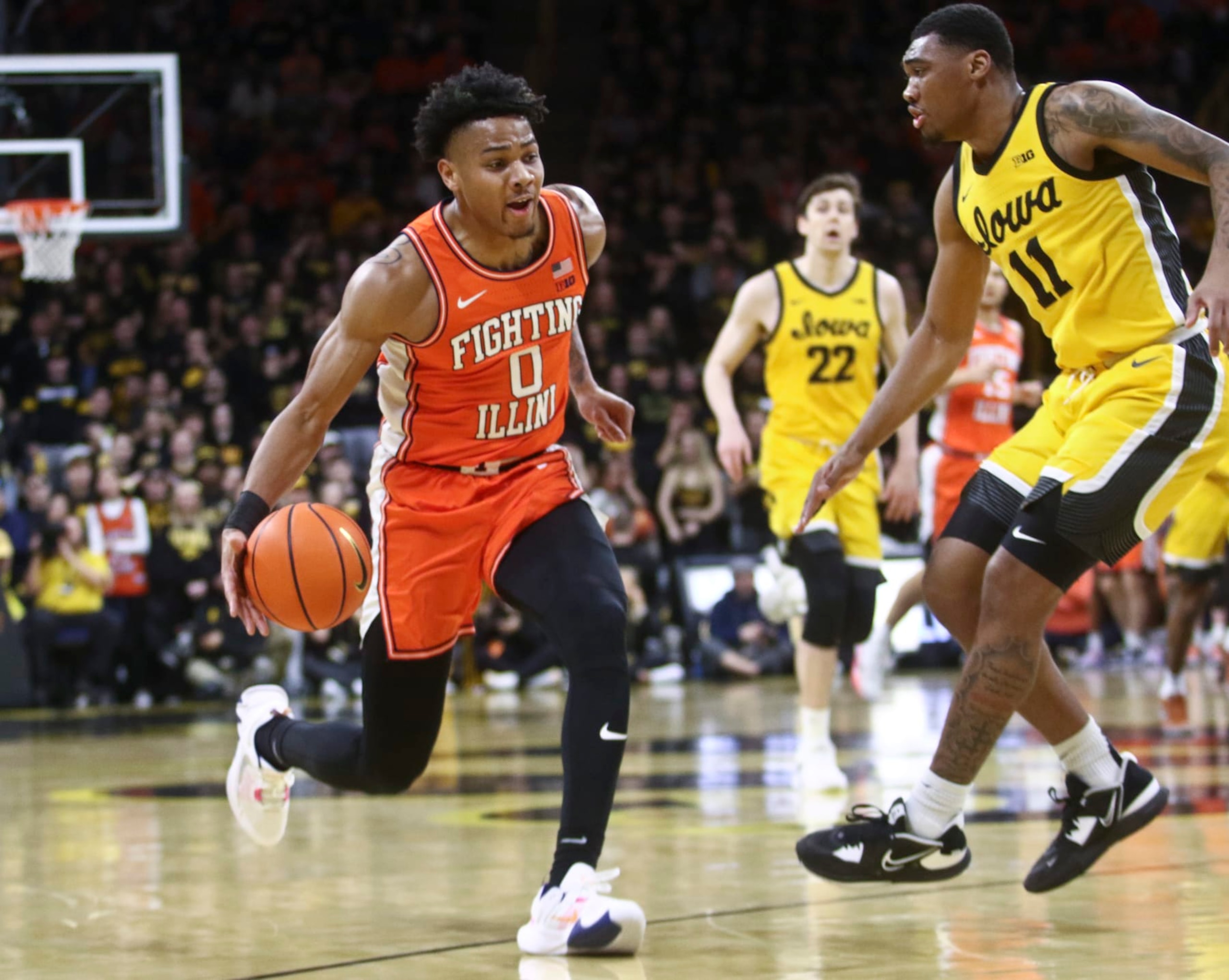 IOWA CITY, IOWA - FEBRUARY 04:  Guard Terrence Shannon #0 of the Illinois Fighting Illini drives to the basket during the first half against guard Tony Perkins #11 of the Iowa Hawkeyes  at Carver-Hawkeye Arena, on February 4, 2023 in Iowa City, Iowa.  (Photo by Matthew Holst/Getty Images)