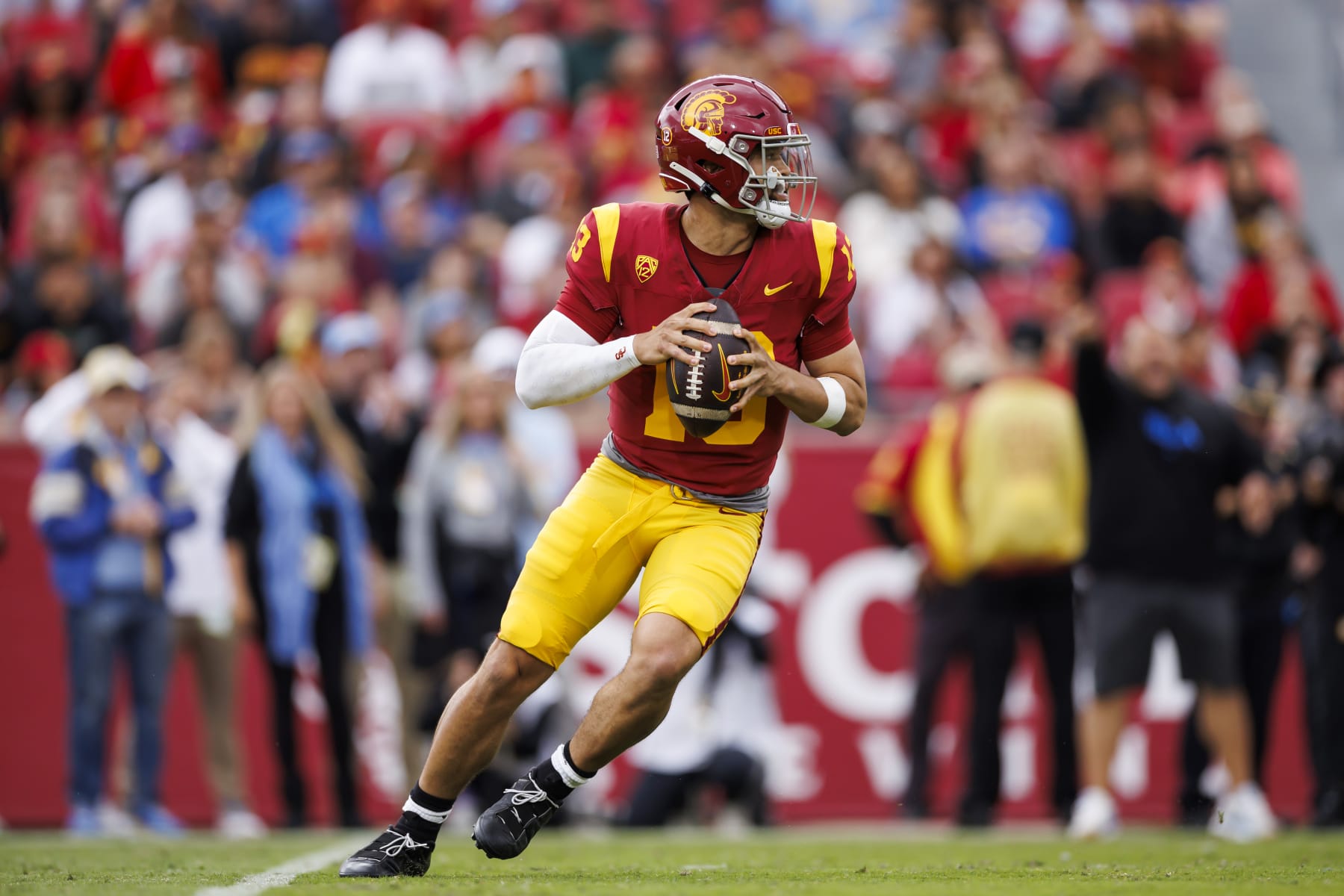 LOS ANGELES, CALIFORNIA - NOVEMBER 18: Caleb Williams #13 of the USC Trojans drops back and looks to throw a pass during the first half of a game against the UCLA Bruins at United Airlines Field at the Los Angeles Memorial Coliseum on November 18, 2023 in Los Angeles, California. (Photo by Ryan Kang/Getty Images)