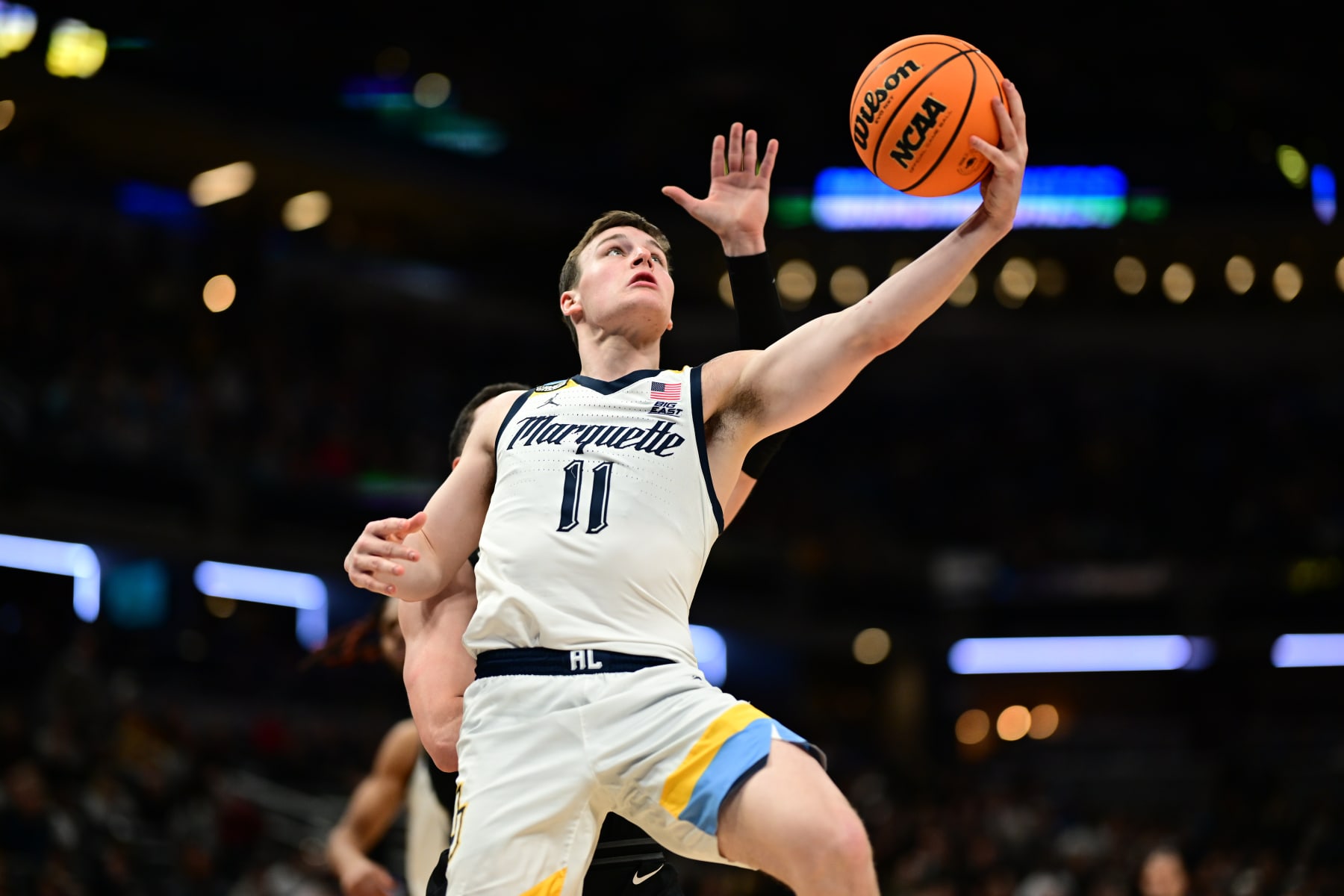 INDIANAPOLIS, INDIANA - MARCH 24: Tyler Kolek #11 of the Marquette Golden Eagles takes a lay up against the Colorado Buffaloes during the second round of the 2024 NCAA Men's Basketball Tournament held at Gainbridge Fieldhouse on March 24, 2024 in Indianapolis, Indiana. (Photo by Ben Solomon/NCAA Photos via Getty Images)