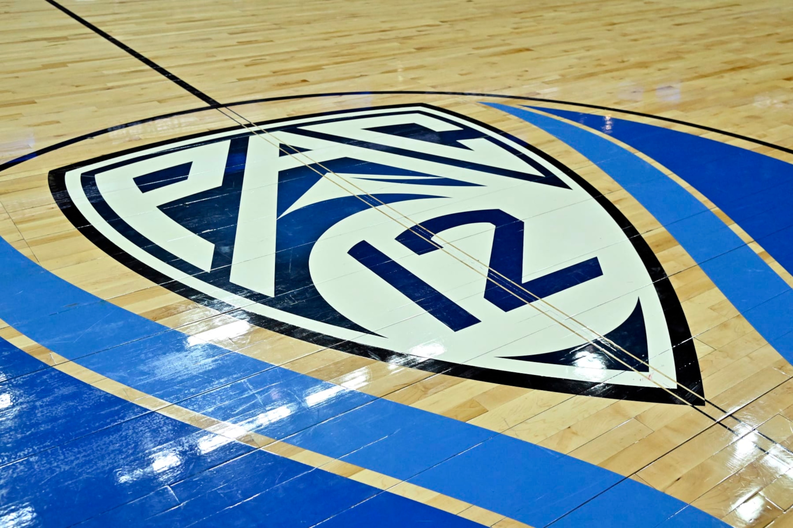 LAS VEGAS, NEVADA - MARCH 15: A Pac-12 tournament logo is shown on the court before a semifinal game between the Arizona Wildcats and the Oregon Ducks in the Pac-12 Conference basketball tournament at T-Mobile Arena on March 15, 2024 in Las Vegas, Nevada. (Photo by David Becker/Getty Images) LAS VEGAS, NEVADA - MARCH 15: A Pac-12 tournament logo is shown on the court before a semifinal game between the Arizona Wildcats and the Oregon Ducks in the Pac-12 Conference basketball tournament at T-Mobile Arena on March 15, 2024 in Las Vegas, Nevada. (Photo by David Becker/Getty Images)