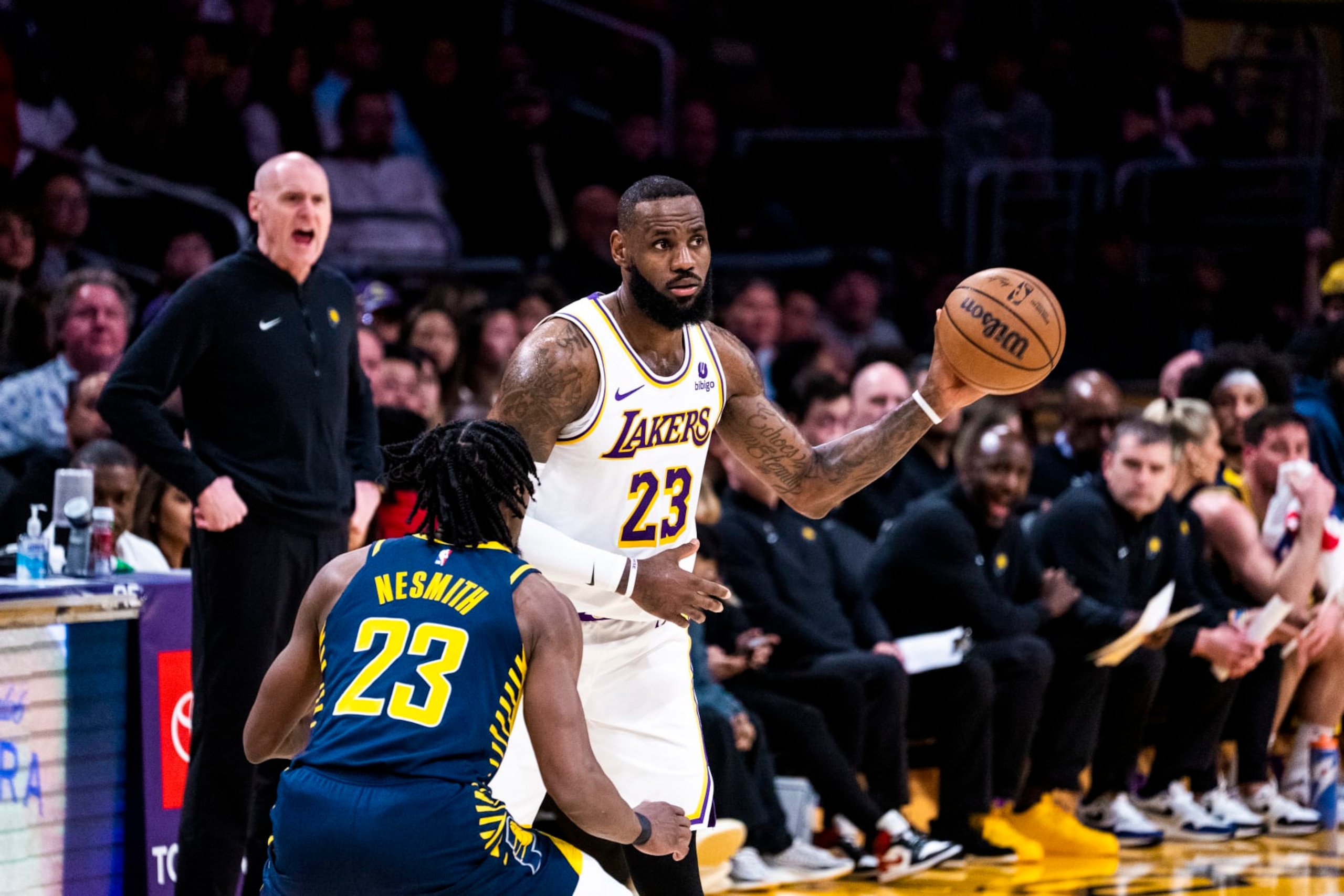LOS ANGELES, CA - MARCH 24: LeBron James #23 of the Los Angeles Lakers handles the ball during the game against the Indiana Pacers on March 24, 2024 at Crypto.Com Arena in Los Angeles, California. NOTE TO USER: User expressly acknowledges and agrees that, by downloading and/or using this Photograph, user is consenting to the terms and conditions of the Getty Images License Agreement. Mandatory Copyright Notice: Copyright 2024 NBAE (Photo by Tyler Ross/NBAE via Getty Images)