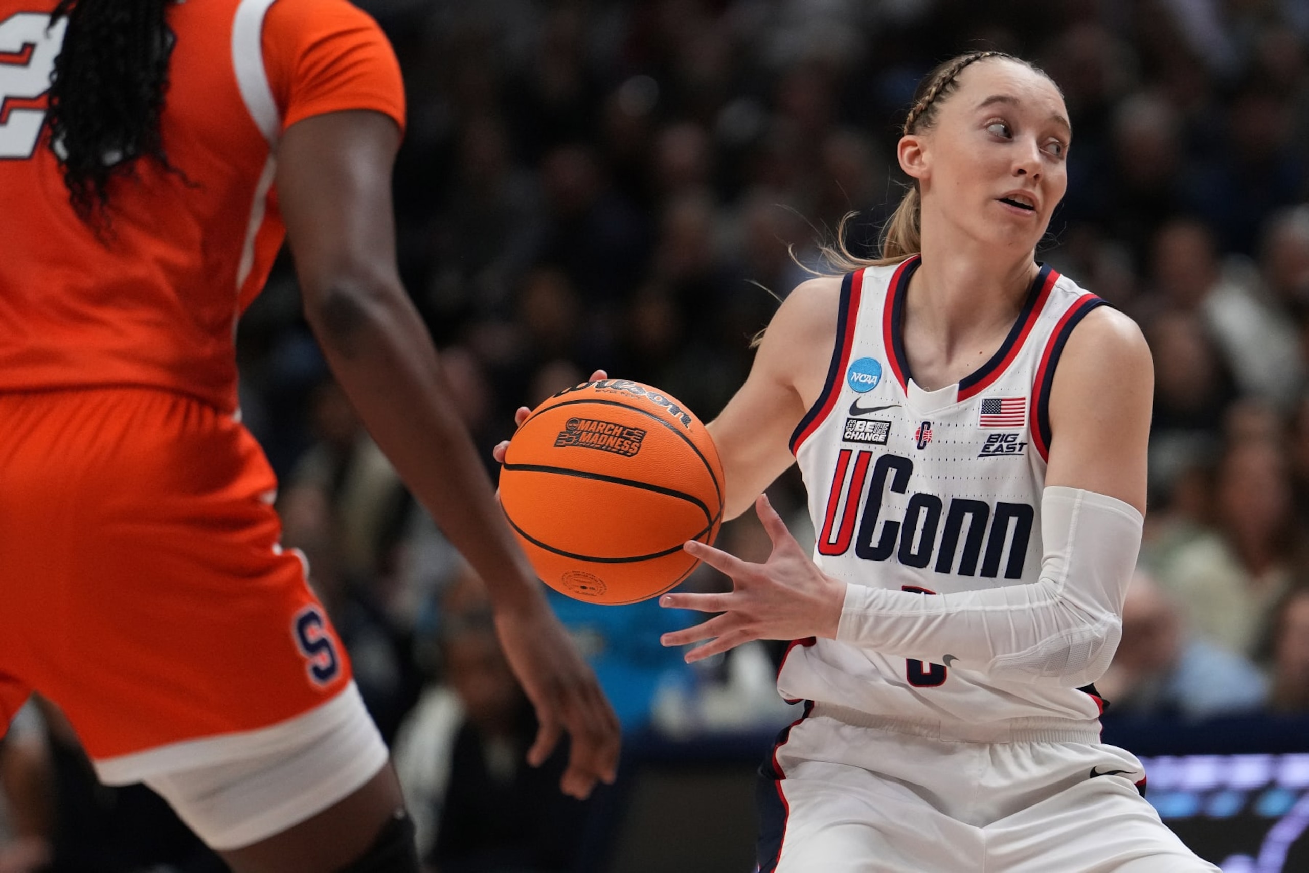 STORRS, CONNECTICUT - MARCH 25: Paige Bueckers #5 of the Connecticut Huskies looks for the open pass against the Syracuse Orange during the second half of a second round NCAA Women's Basketball Tournament game at the Harry A. Gampel Pavilion on March 25, 2024 in Storrs, Connecticut. (Photo by Joe Buglewicz/Getty Images) STORRS, CONNECTICUT - MARCH 25: Paige Bueckers #5 of the Connecticut Huskies looks for the open pass against the Syracuse Orange during the second half of a second round NCAA Women's Basketball Tournament game at the Harry A. Gampel Pavilion on March 25, 2024 in Storrs, Connecticut. (Photo by Joe Buglewicz/Getty Images)