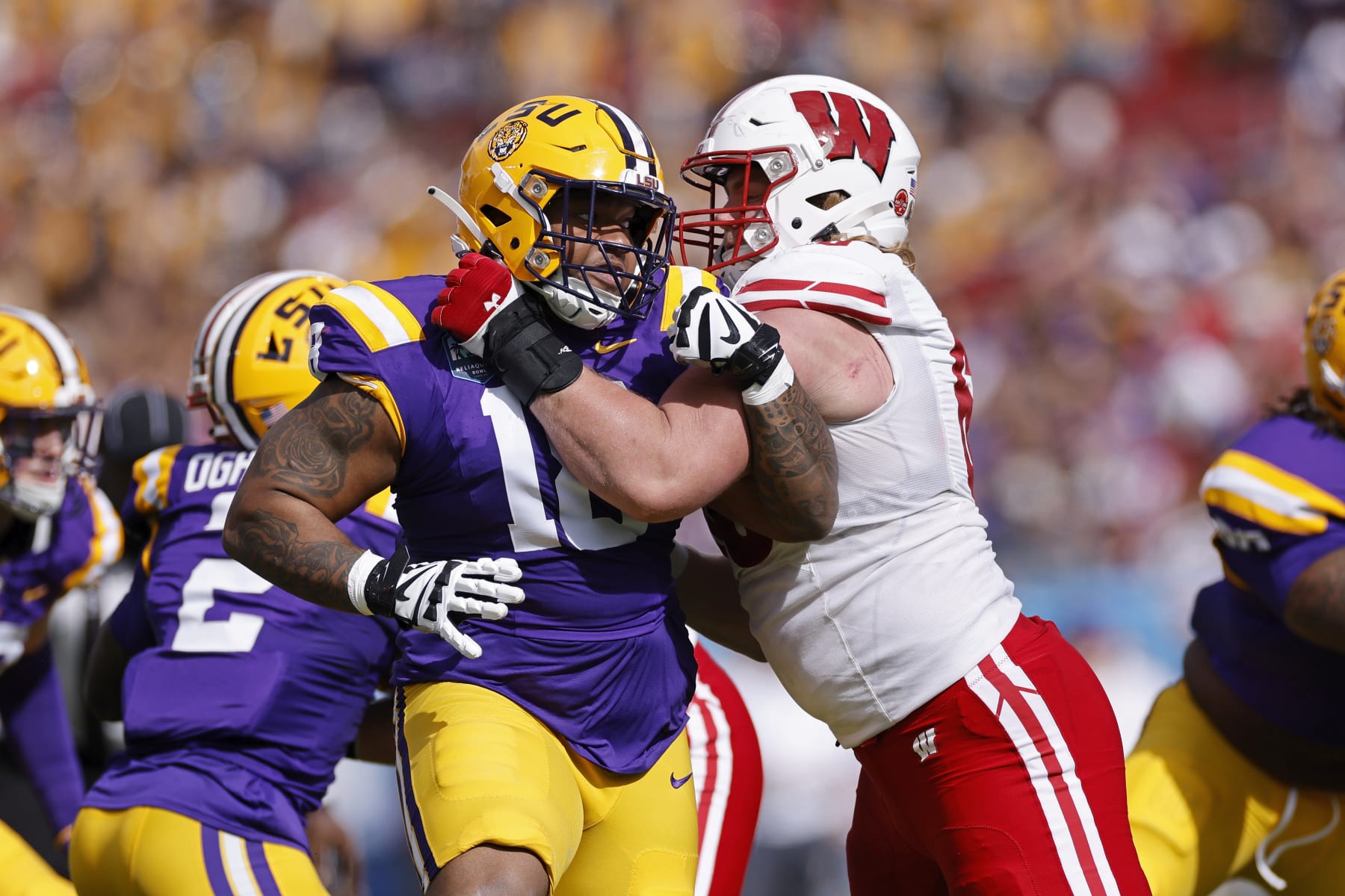 TAMPA, FL - JANUARY 01: LSU Tigers defensive tackle Mekhi Wingo (18) rushes against Wisconsin Badgers offensive lineman Nolan Rucci (66) during the ReliaQuest Bowl on January 1, 2024 at Raymond James Stadium in Tampa, Florida. (Photo by Joe Robbins/Icon Sportswire via Getty Images)