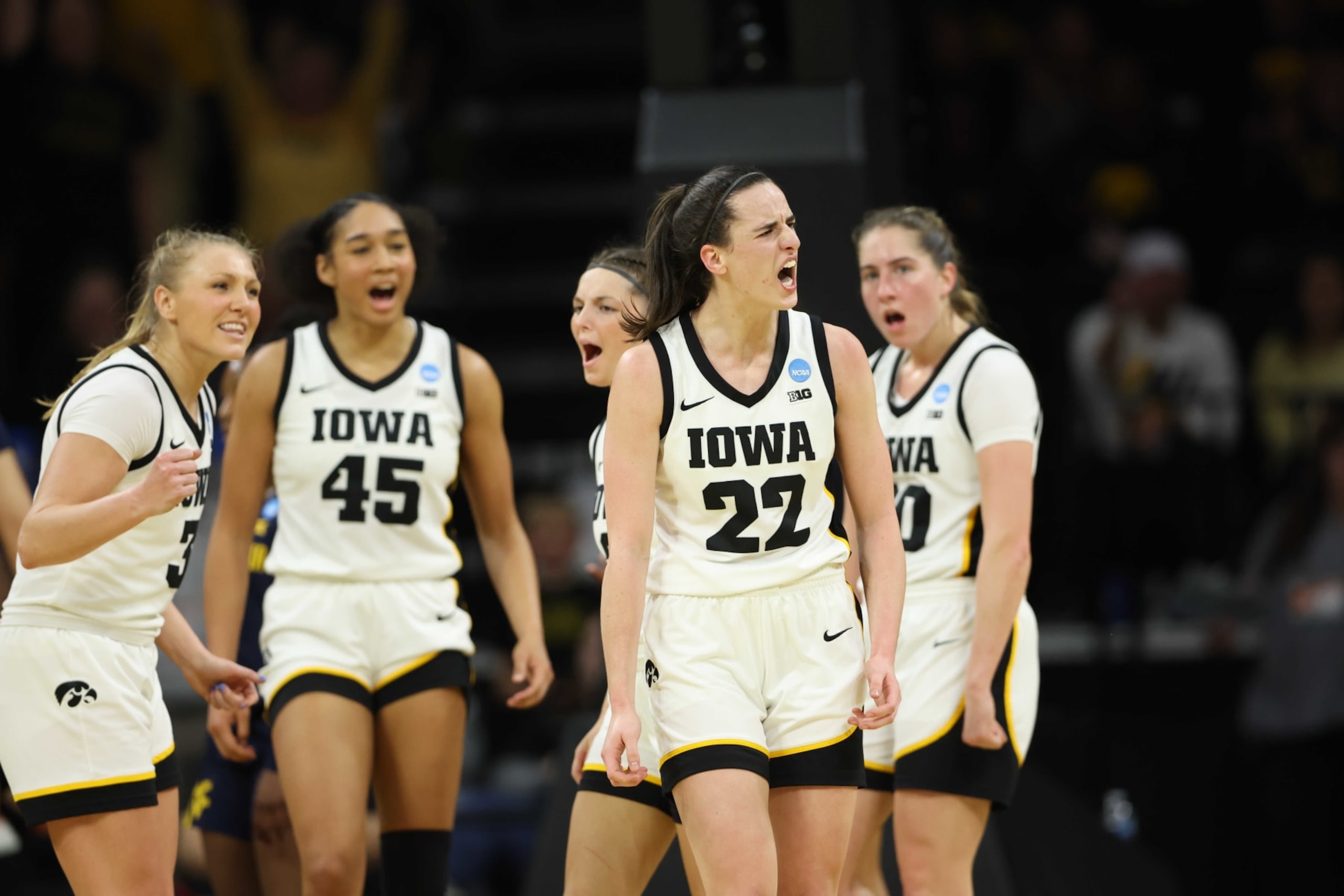 IOWA CITY, IOWA - MARCH 25: Caitlin Clark #22 of the Iowa Hawkeyes reacts after a play against the West Virginia Mountaneers during the second round of the 2024 NCAA Women's Basketball Tournament held at Carver-Hawkeye Arena on March 25, 2024 in Iowa City, Iowa. (Photo by Rebecca Gratz/NCAA Photos via Getty Images) IOWA CITY, IOWA - MARCH 25: Caitlin Clark #22 of the Iowa Hawkeyes reacts after a play against the West Virginia Mountaneers during the second round of the 2024 NCAA Women's Basketball Tournament held at Carver-Hawkeye Arena on March 25, 2024 in Iowa City, Iowa. (Photo by Rebecca Gratz/NCAA Photos via Getty Images)