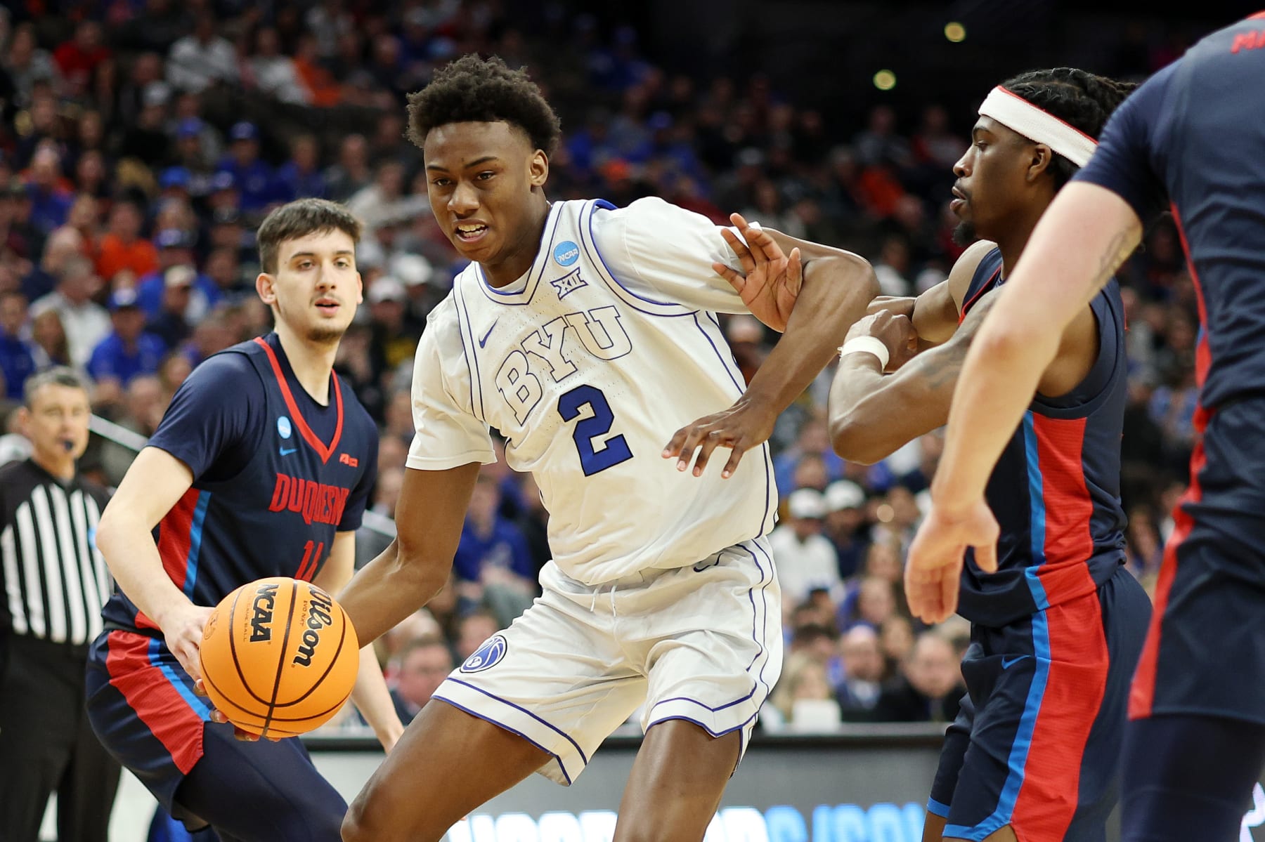 OMAHA, NEBRASKA - MARCH 21: Jaxson Robinson #2 of the Brigham Young Cougars drives the ball against the Duquesne Dukes in the first round of the NCAA Men's Basketball Tournament at CHI Health Center on March 21, 2024 in Omaha, Nebraska. (Photo by Jamie Squire/Getty Images)
