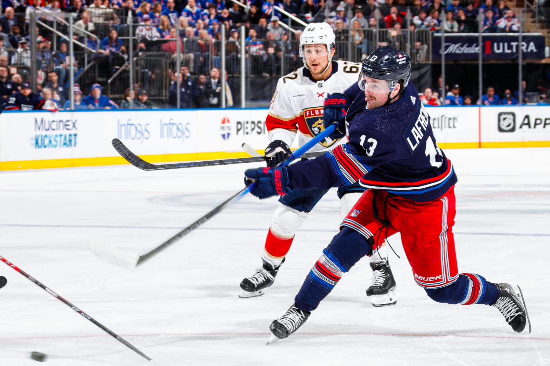 NEW YORK, NEW YORK - MARCH 23:  Alexis Lafreniere #13 of the New York Rangers shoots the puck against the Florida Panthers at Madison Square Garden on March 23, 2024 in New York City. (Photo by Jared Silber/NHLI via Getty Images)