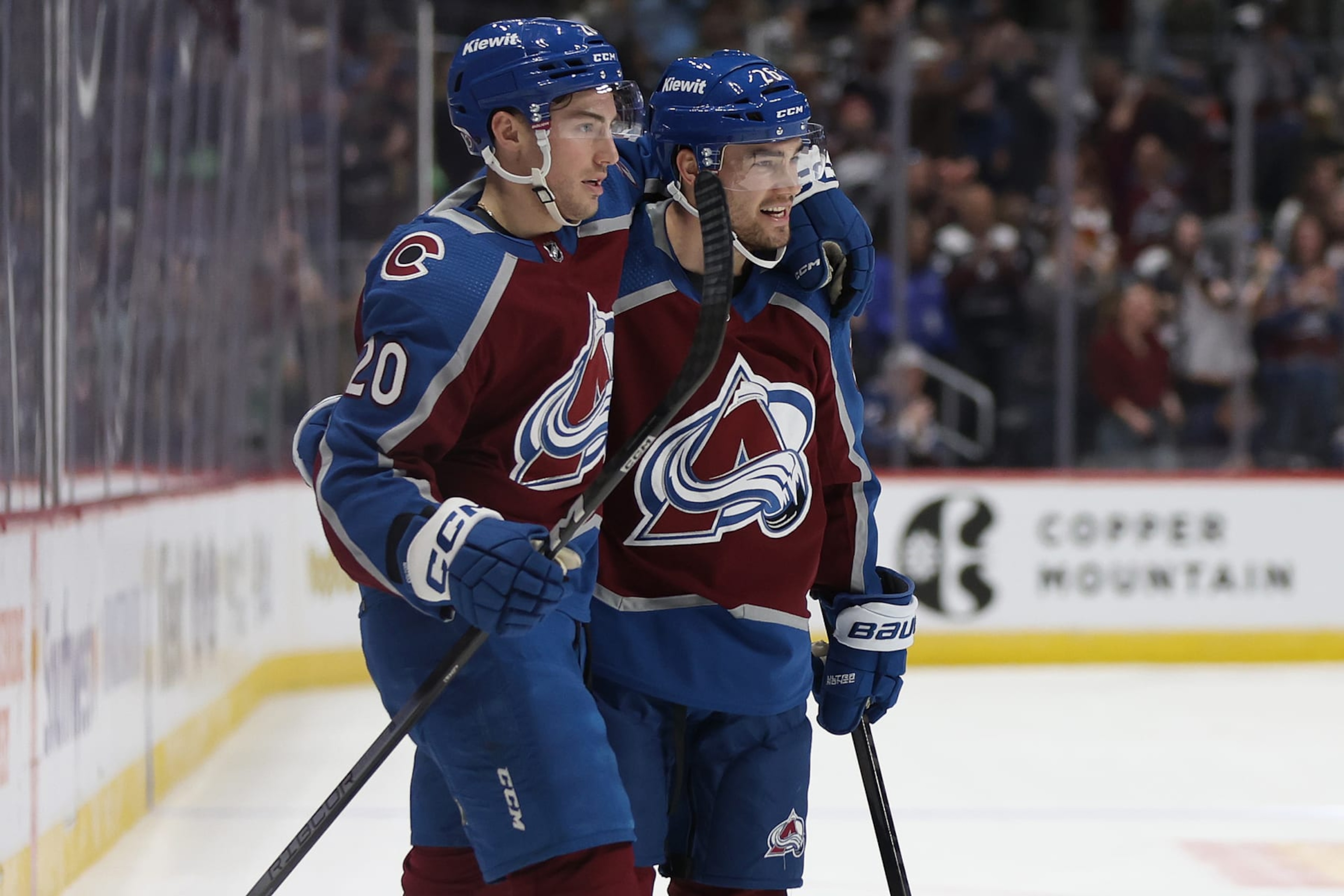 DENVER, COLORADO - MARCH 24: Ross Colton #20 and Sean Walker #26 of the Colorado Avalanche celebrate a goal against the Pittsburgh Penguins during the second period at Ball Arena on March 24, 2024 in Denver, Colorado. (Photo by Matthew Stockman/Getty Images)