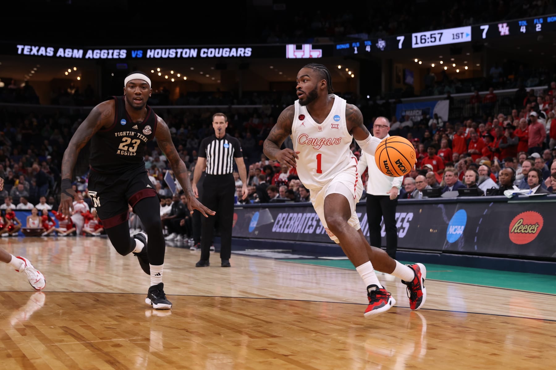 MEMPHIS, TENNESSEE - MARCH 24: Jamal Shead #1 of the Houston Cougars drives to the basket against Tyrece Radford #23 of the Texas A&M Aggies during the second round of the 2024 NCAA Men's Basketball Tournament held at FedExForum on March 24, 2024 in Memphis, Tennessee. (Photo by Joe Murphy/NCAA Photos via Getty Images)