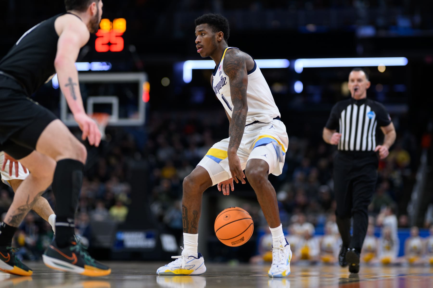 INDIANAPOLIS, IN - MARCH 24: Marquette Golden Eagles guard Kam Jones (1) brings the ball up the court during the Marquette Golden Eagles versus the Colorado Buffaloes in the second round of the NCAA Division 1 Championship on March 24, 2024, at Gainbridge Fieldhouse in Indianapolis, IN. (Photo by Zach Bolinger/Icon Sportswire via Getty Images)