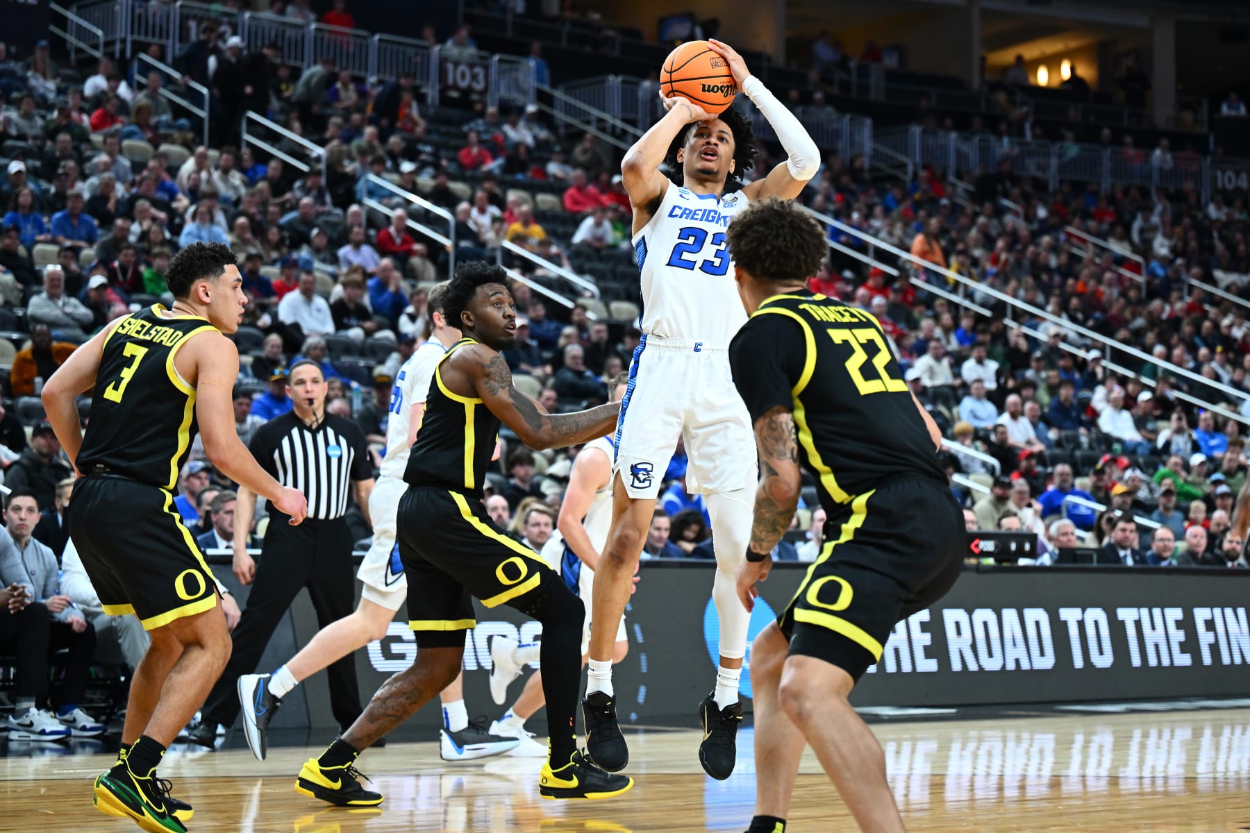 PITTSBURGH, PENNSYLVANIA - MARCH 23: Trey Alexander #23 of the Creighton Bluejays shoots past Jadrian Tracey #22 of the Oregon Ducks during the second half of a game in the second round of the NCAA Men's Basketball Tournament at PPG PAINTS Arena on March 23, 2024 in Pittsburgh, Pennsylvania. (Photo by Joe Sargent/Getty Images)