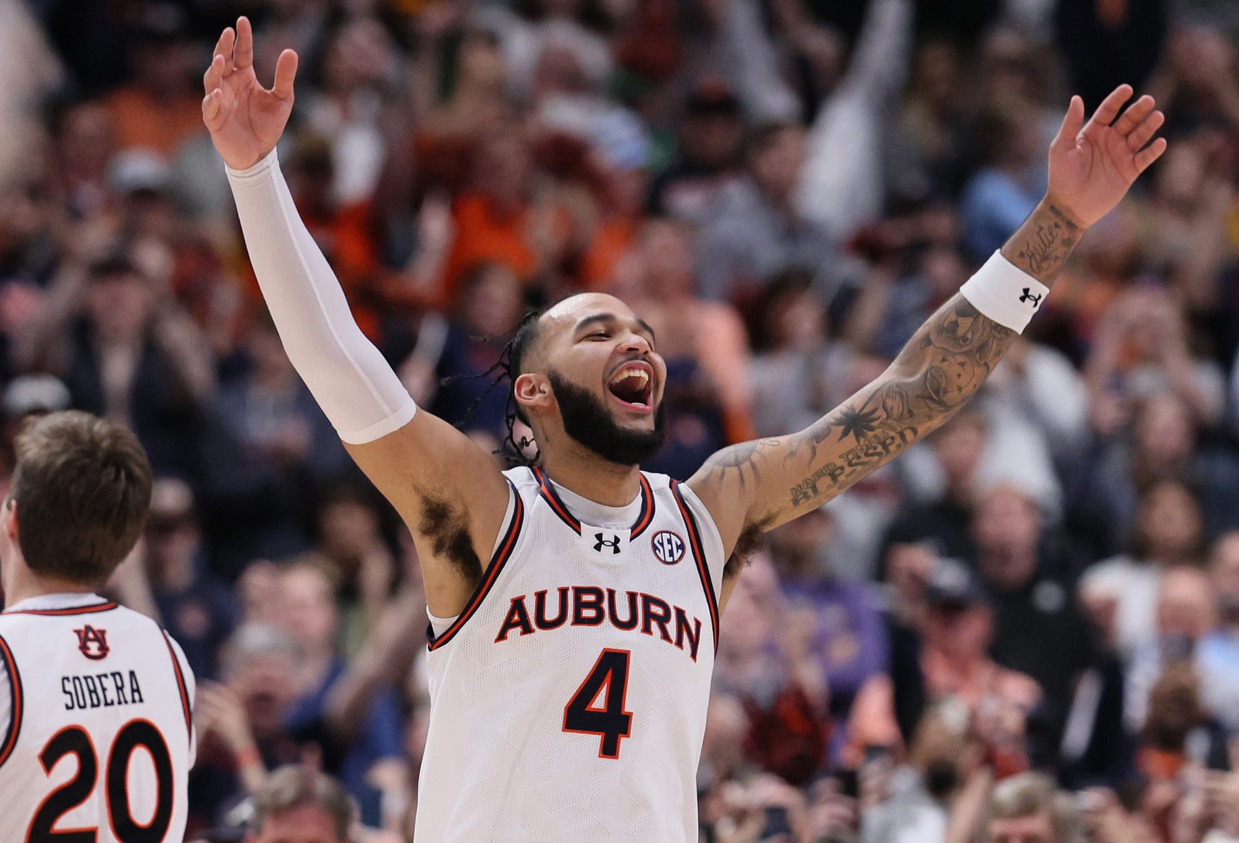 NASHVILLE, TENNESSEE - MARCH 17: Johni Broome #4 of the Auburn Tigers celebrates after the victory against the Florida Gators in the championship game of the SEC Basketball Tournament at Bridgestone Arena on March 17, 2024 in Nashville, Tennessee. (Photo by Andy Lyons/Getty Images)