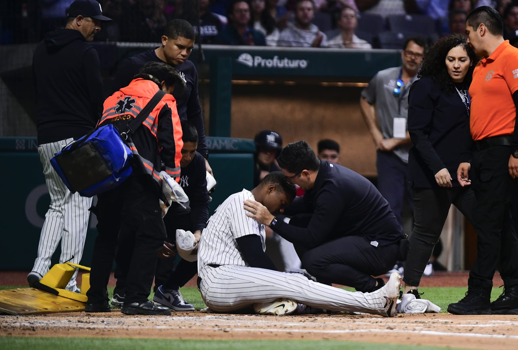MEXICO CITY, MEXICO - MARCH 25: Oscar Gonzalez of New York Yankees lies on the field after getting hit in the face by a ball in the second inning during Spring Training Game Two between Diablos Rojos and New York Yankees at Estadio Alfredo Harp Helu on March 25, 2024 in Mexico City, Mexico. (Photo by Jaime Lopez/Jam Media/Getty Images)