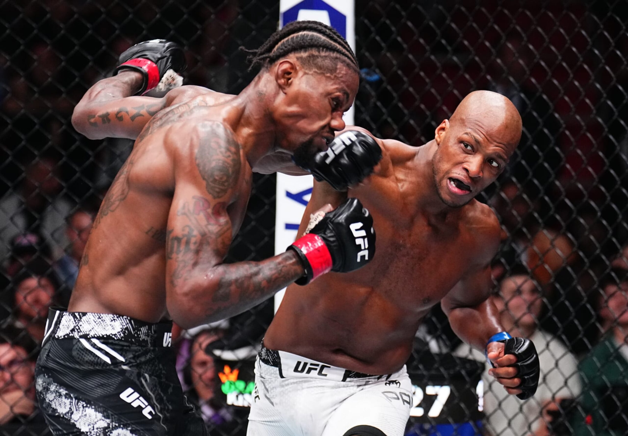 Page lands a punch on Kevin Holland at UFC 299