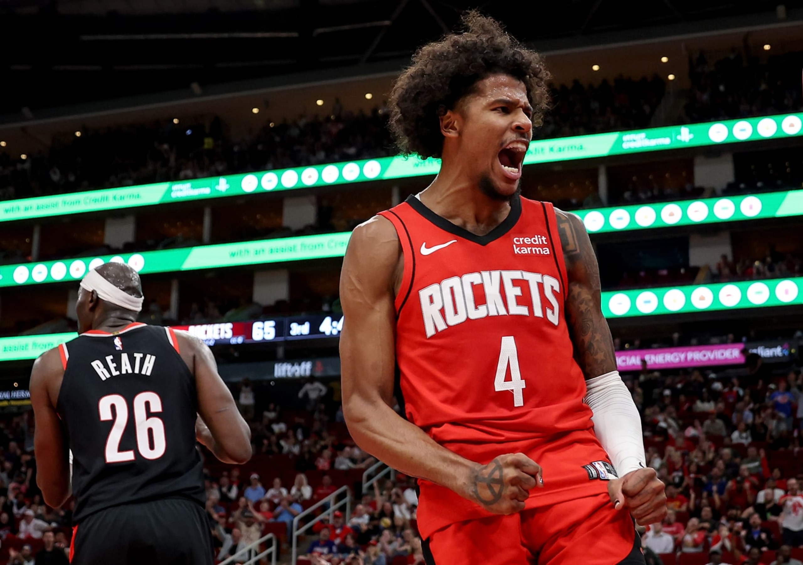 HOUSTON, TEXAS - MARCH 25: Jalen Green #4 of the Houston Rockets reacts after a dunk in the second half against the Portland Trail Blazers at Toyota Center on March 25, 2024 in Houston, Texas.  NOTE TO USER: User expressly acknowledges and agrees that, by downloading and or using this photograph, User is consenting to the terms and conditions of the Getty Images License Agreement. (Photo by Tim Warner/Getty Images)
