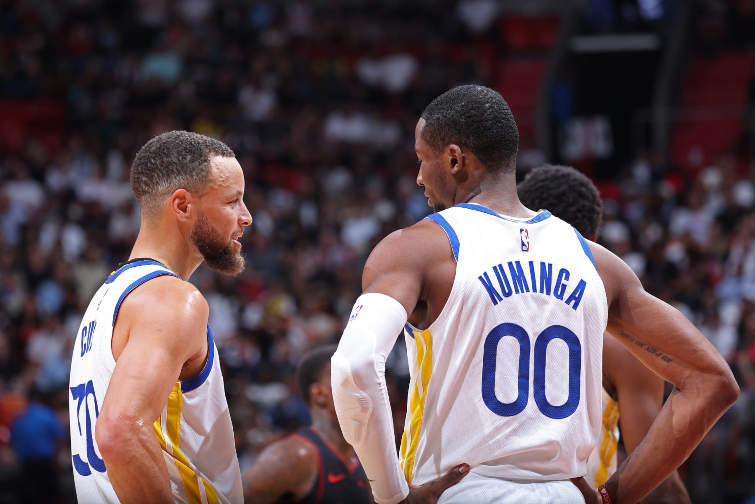 Stephen Curry and Jonathan Kuminga Stephen Curry and Jonathan Kuminga