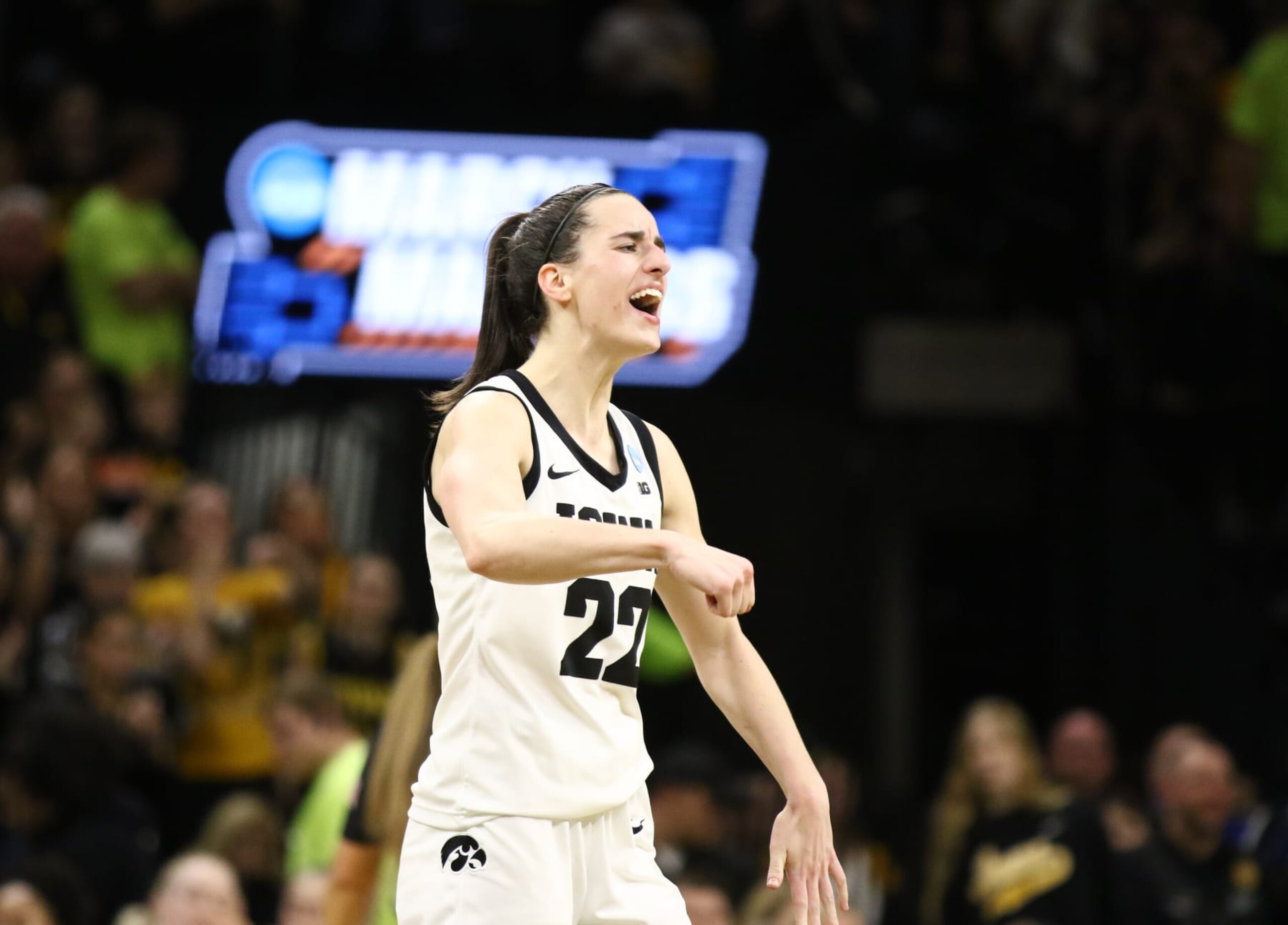 IOWA CITY, IOWA- MARCH 25: Guard Caitlin Clark #22 of the Iowa Hawkeyes celebrates after drawing a foul late in the second half against the West Virginia Mountaineers during their second round match-up in the 2024 NCAA Division 1 Women's Basketball Championship at Carver-Hawkeye Arena on March 25, 2024 in Iowa City, Iowa. (Photo by Matthew Holst/Getty Images)
