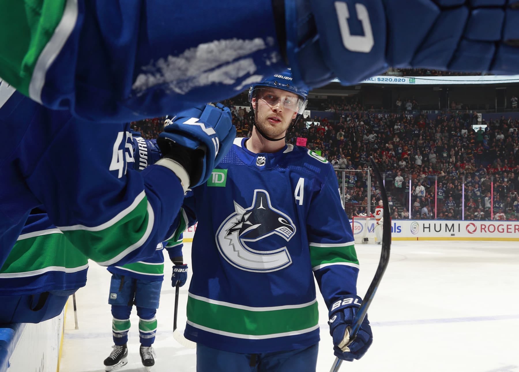 VANCOUVER, CANADA - MARCH 23: Elias Pettersson #40 of the Vancouver Canucks celebrates after a Vancouver goal during their NHL game against the Calgary Flames at Rogers Arena on March 23, 2024 in Vancouver, British Columbia, Canada.  (Photo by Jeff Vinnick/NHLI via Getty Images)
