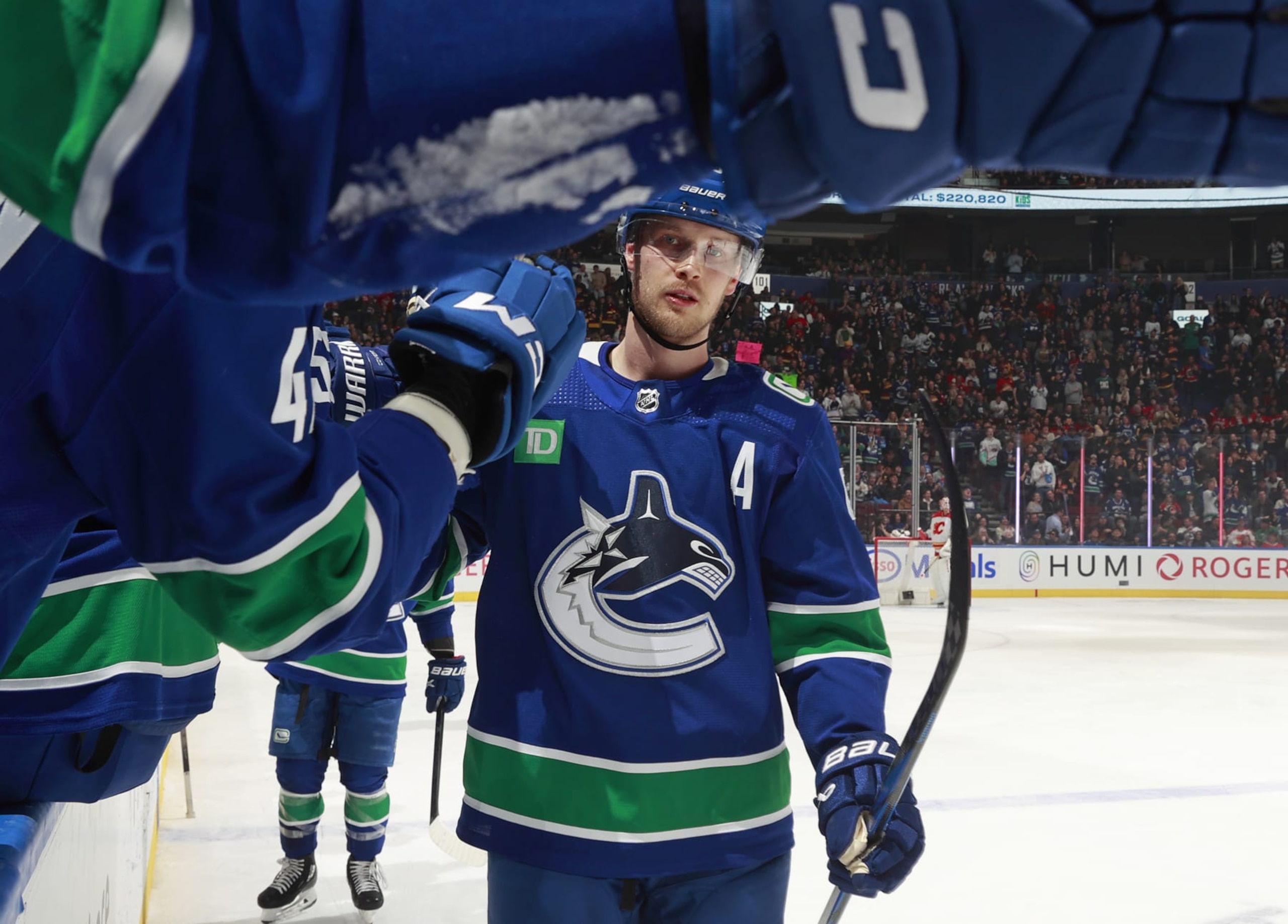 VANCOUVER, CANADA - MARCH 23: Elias Pettersson #40 of the Vancouver Canucks celebrates after a Vancouver goal during their NHL game against the Calgary Flames at Rogers Arena on March 23, 2024 in Vancouver, British Columbia, Canada.  (Photo by Jeff Vinnick/NHLI via Getty Images)