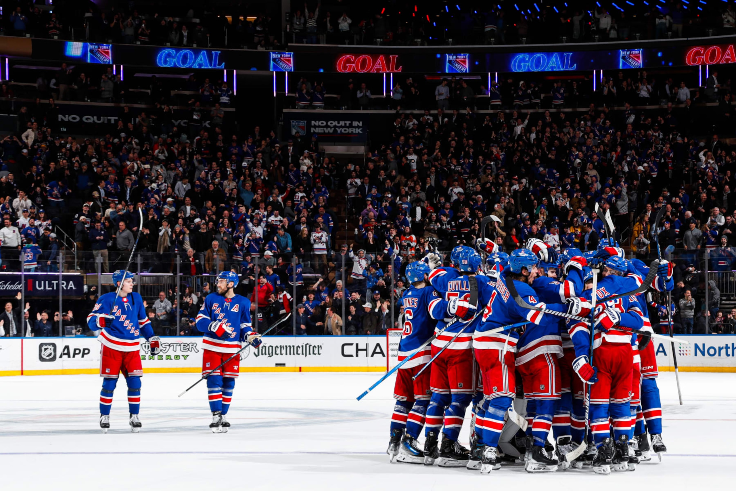 NEW YORK, NEW YORK - MARCH 26:  Adam Fox #23 of the New York Rangers celebrates with teammates after scoring the game winning goal in overtime against the Philadelphia Flyers at Madison Square Garden on March 26, 2024 in New York City. (Photo by Jared Silber/NHLI via Getty Images)
