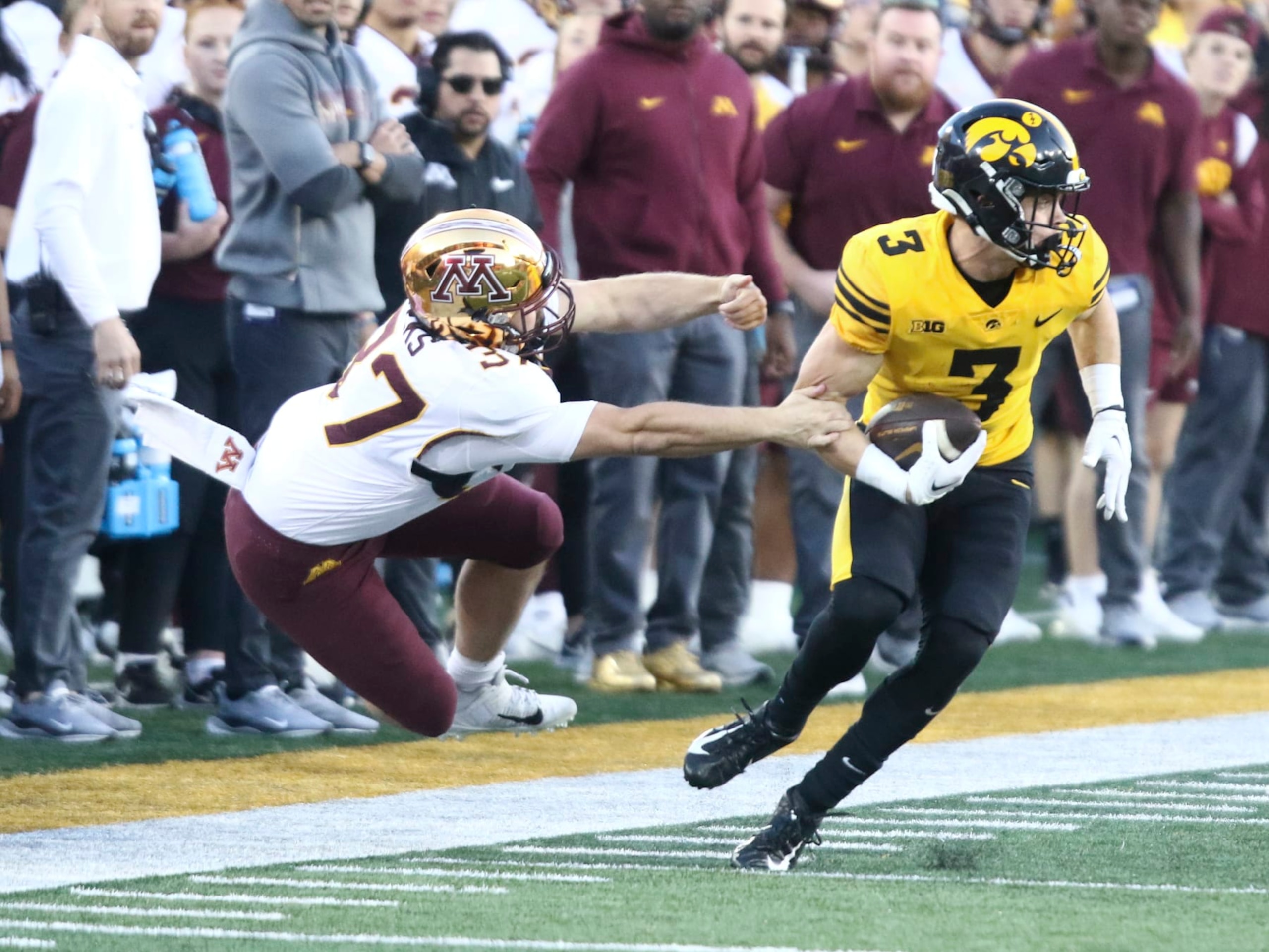 IOWA CITY, IOWA- OCTOBER 21: Defensive back Cooper DeJean #3 of the Iowa Hawkeyes breaks a tackle during a called-back touchdown kick return during the second half by long snapper Brady Weeks #37 of the Minnesota Golden Gophers at Kinnick Stadium on October 21, 2023 in Iowa City, Iowa. (Photo by Matthew Holst/Getty Images) IOWA CITY, IOWA- OCTOBER 21: Defensive back Cooper DeJean #3 of the Iowa Hawkeyes breaks a tackle during a called-back touchdown kick return during the second half by long snapper Brady Weeks #37 of the Minnesota Golden Gophers at Kinnick Stadium on October 21, 2023 in Iowa City, Iowa. (Photo by Matthew Holst/Getty Images)