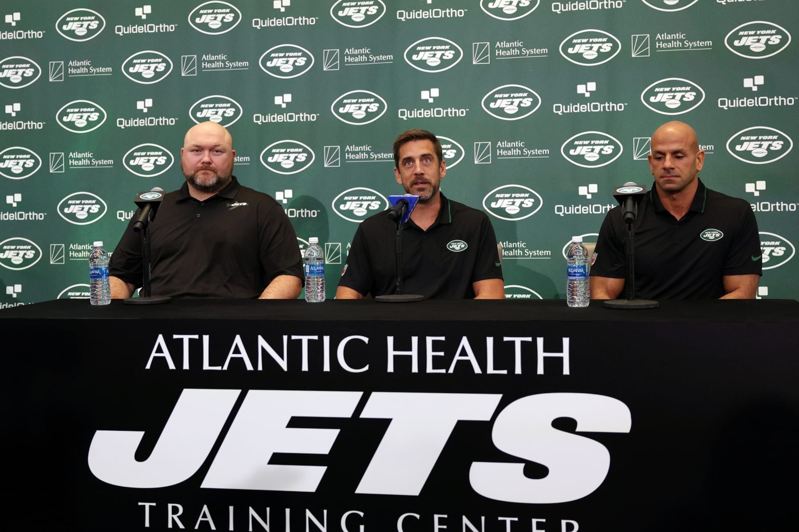 FLORHAM PARK, NEW JERSEY - APRIL 26: (L-R) New York Jets general manager Joe Douglas, quarterback Aaron Rodgers and head coach Robert Saleh attend a press conference at Atlantic Health Jets Training Center on April 26, 2023 in Florham Park, New Jersey. (Photo by Elsa/Getty Images)